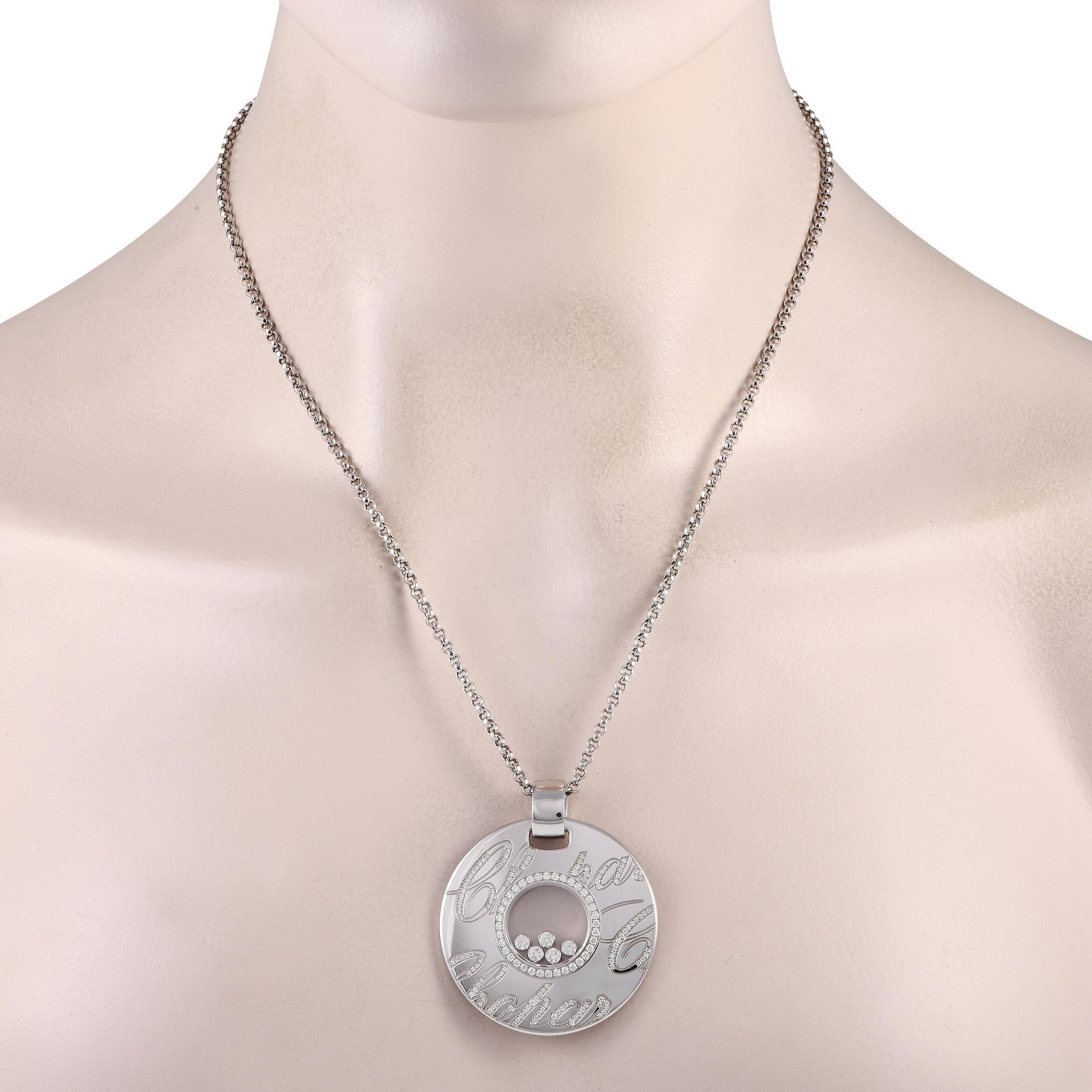 This Chopard Happy Diamonds necklace is endlessly captivating. Sparkling Diamonds with a total weight of 1.14 carats accent the circular pendant and float within the transparent center. Crafted from 18K White Gold, the pendant measures 1.75 long by