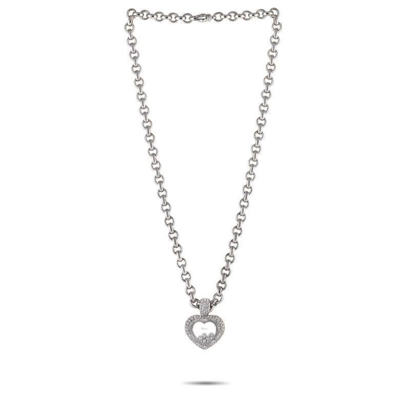 Loose diamonds add movement to the center of this Chopard Happy Diamond necklace’s transparent heart-shaped pendant. The pendant measures 1.5” long, 1.15” wide, and shines to life thanks to diamonds with a total weight of approximately 3.0 carats.