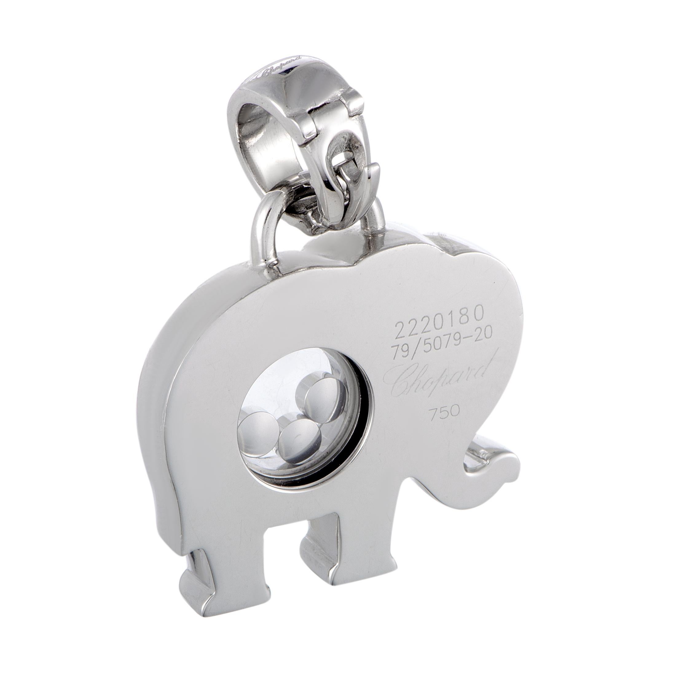 The Chopard “Happy Diamonds” pendant is made of 18K white gold and embellished with diamonds, including three floating ones, and one round blue sapphire. The pendant weighs 14.7 grams, measuring 1.25” in length and 1.00” in width.

This item is