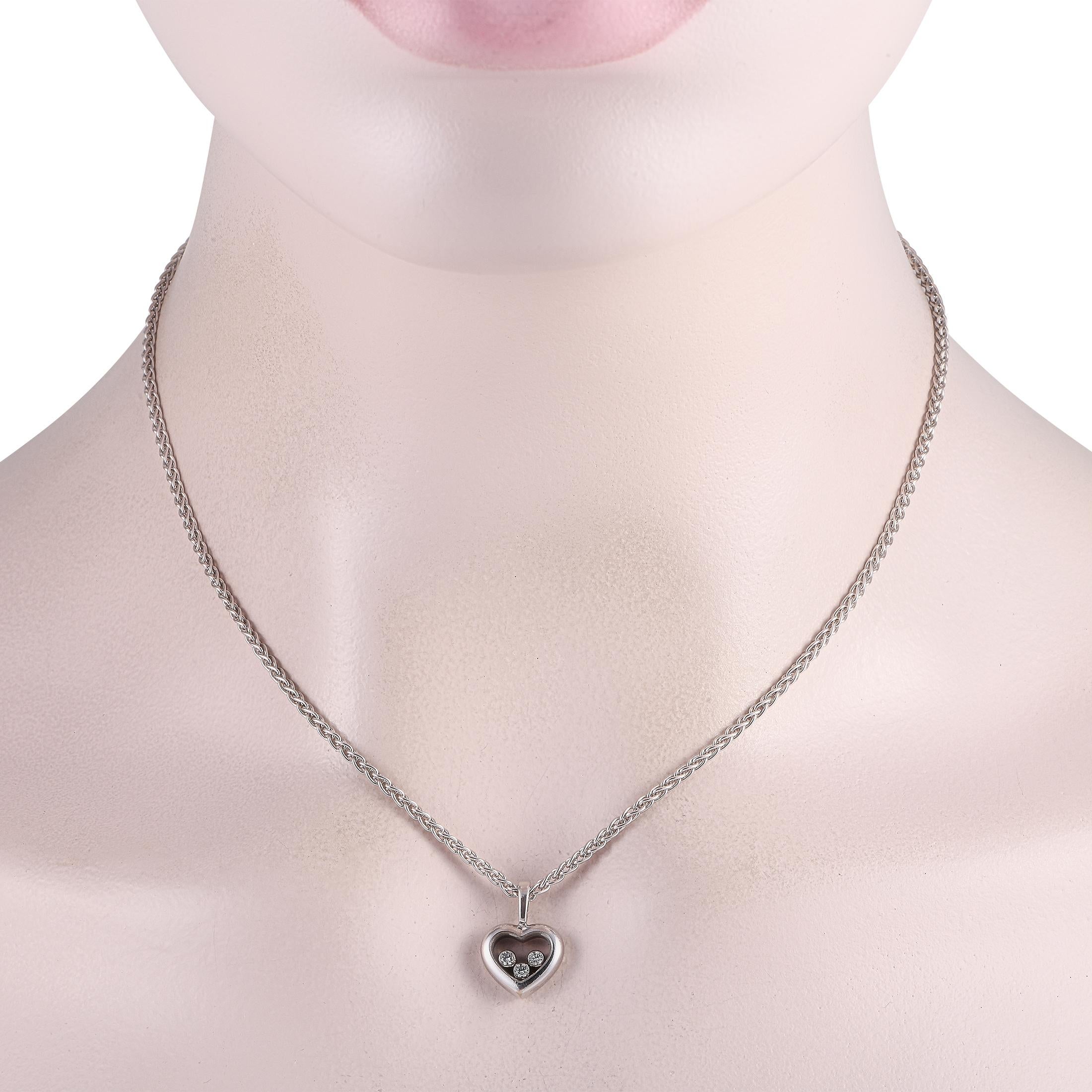 Complete a feminine look with this Chopard Happy Diamonds necklace. It features a heart-shaped white gold pendant with sapphire crystal glass on its front and back. Three bezel-set diamonds move freely inside the polished heart pendant, offering a
