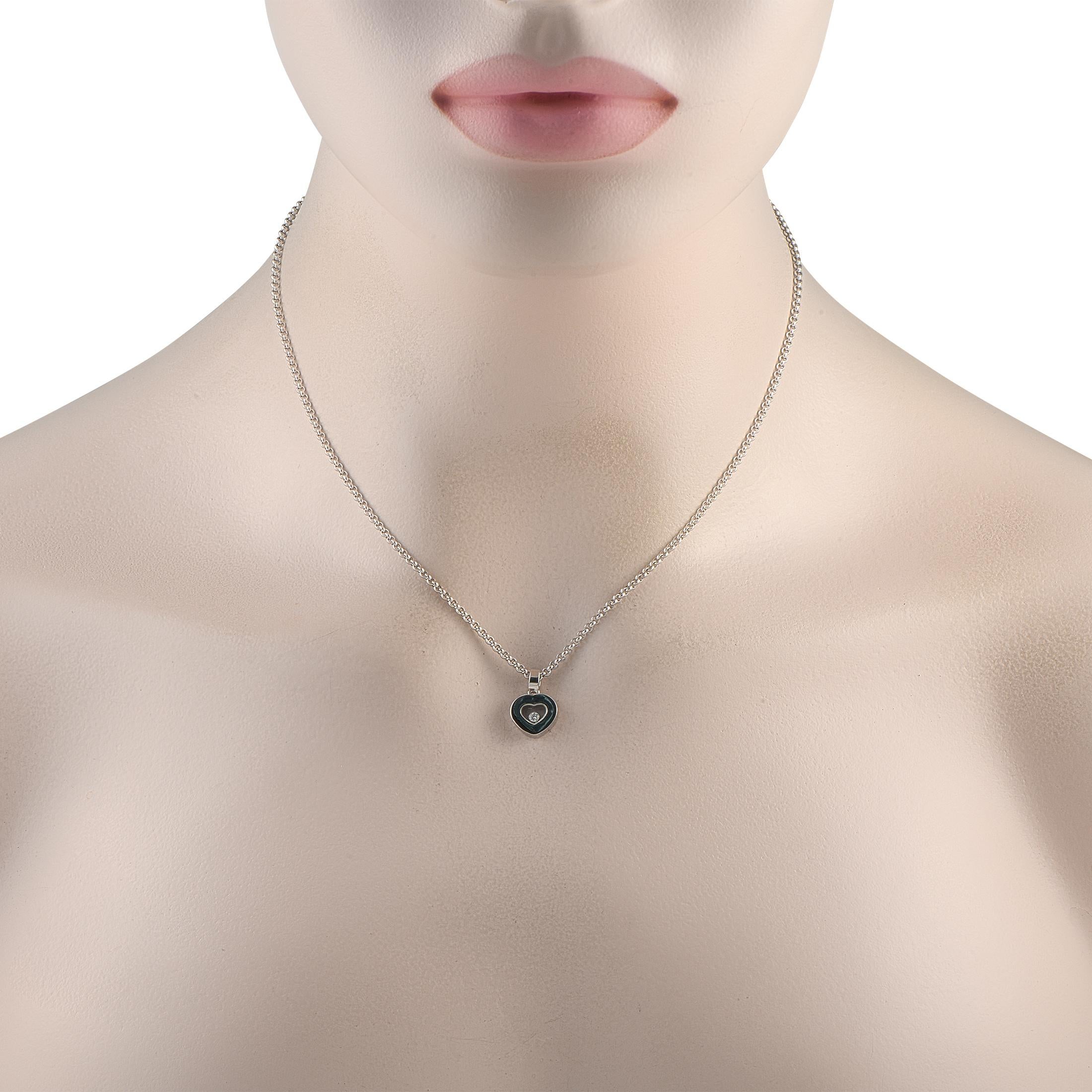 This Chopard Happy necklace is endlessly charming. A singular diamond floats in the transparent, heart-shaped center of the pieces pendant, which measures 0.35 round. Crafted from 18K White Gold, the chain measures 16 long and comes complete with