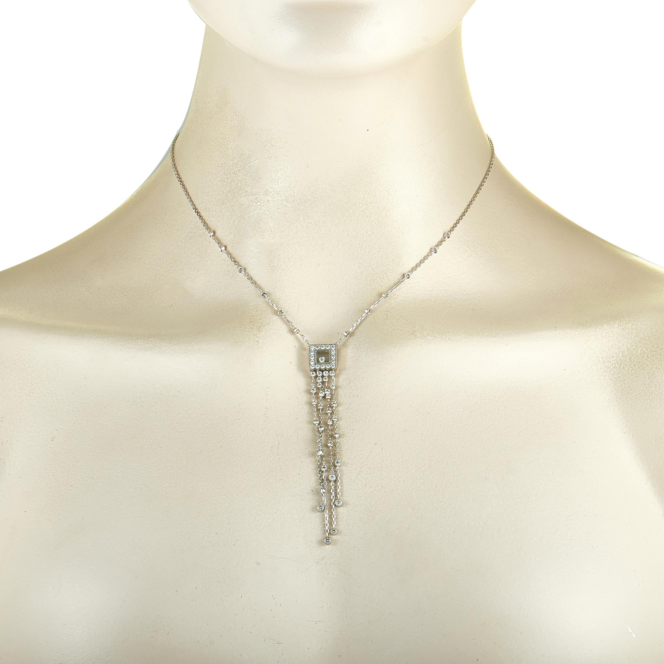 The Chopard “Happy Diamonds” necklace is crafted from 18K white gold, boasting a 14” chain with lobster claw closure and a pendant that measures 3.25” in length and 0.37” in width. The necklace weighs 10.5 grams and is set with a total of 1.63