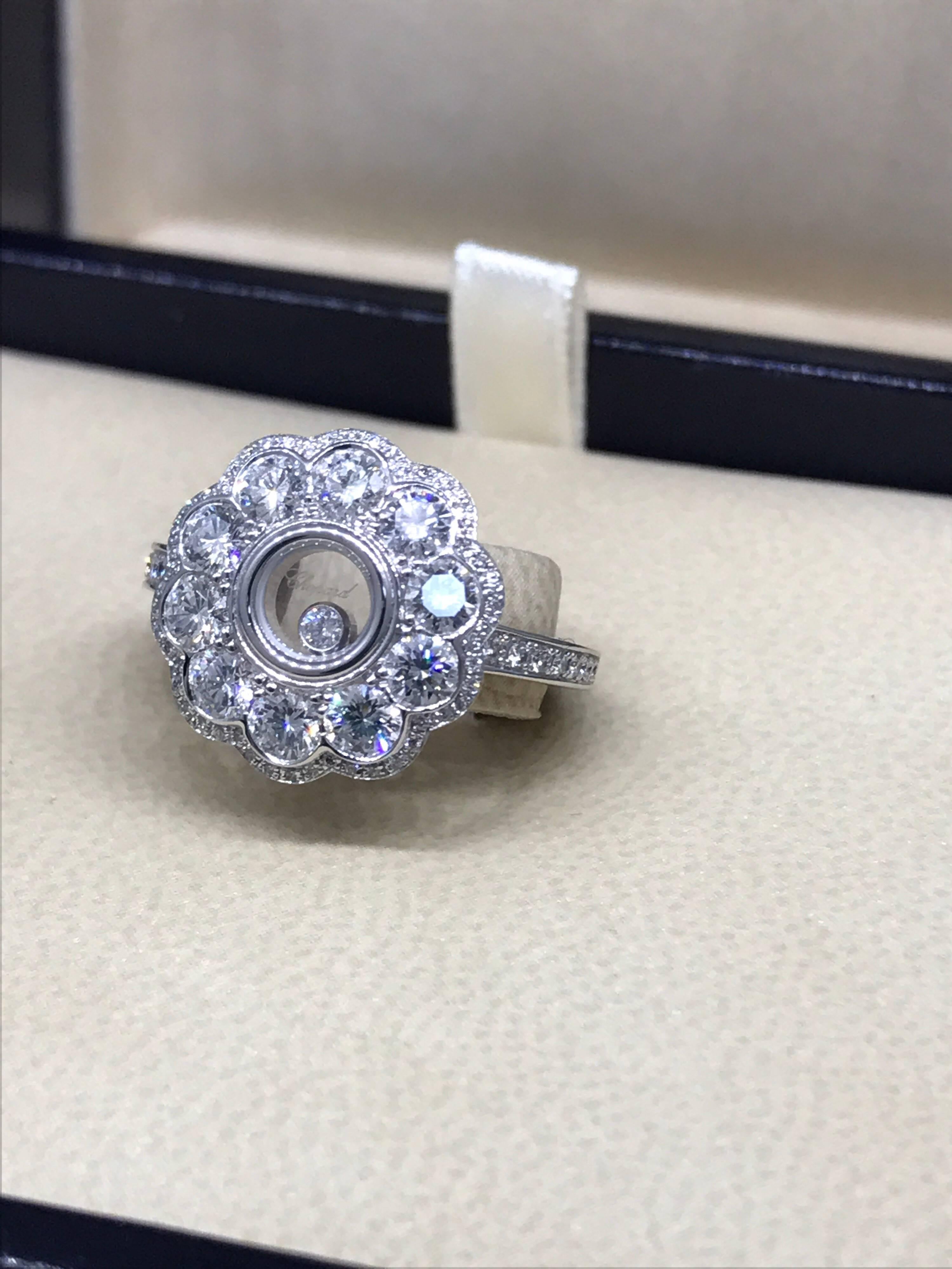 Chopard Happy Diamonds Flower Ring

Model Number: 82/6569-1208

100% Authentic

Brand New

Comes with original Chopard box, certificate of authenticity and warranty, and jewels manual

18 Karat White Gold (6.60gr)

88 Diamonds on the ring (1.32