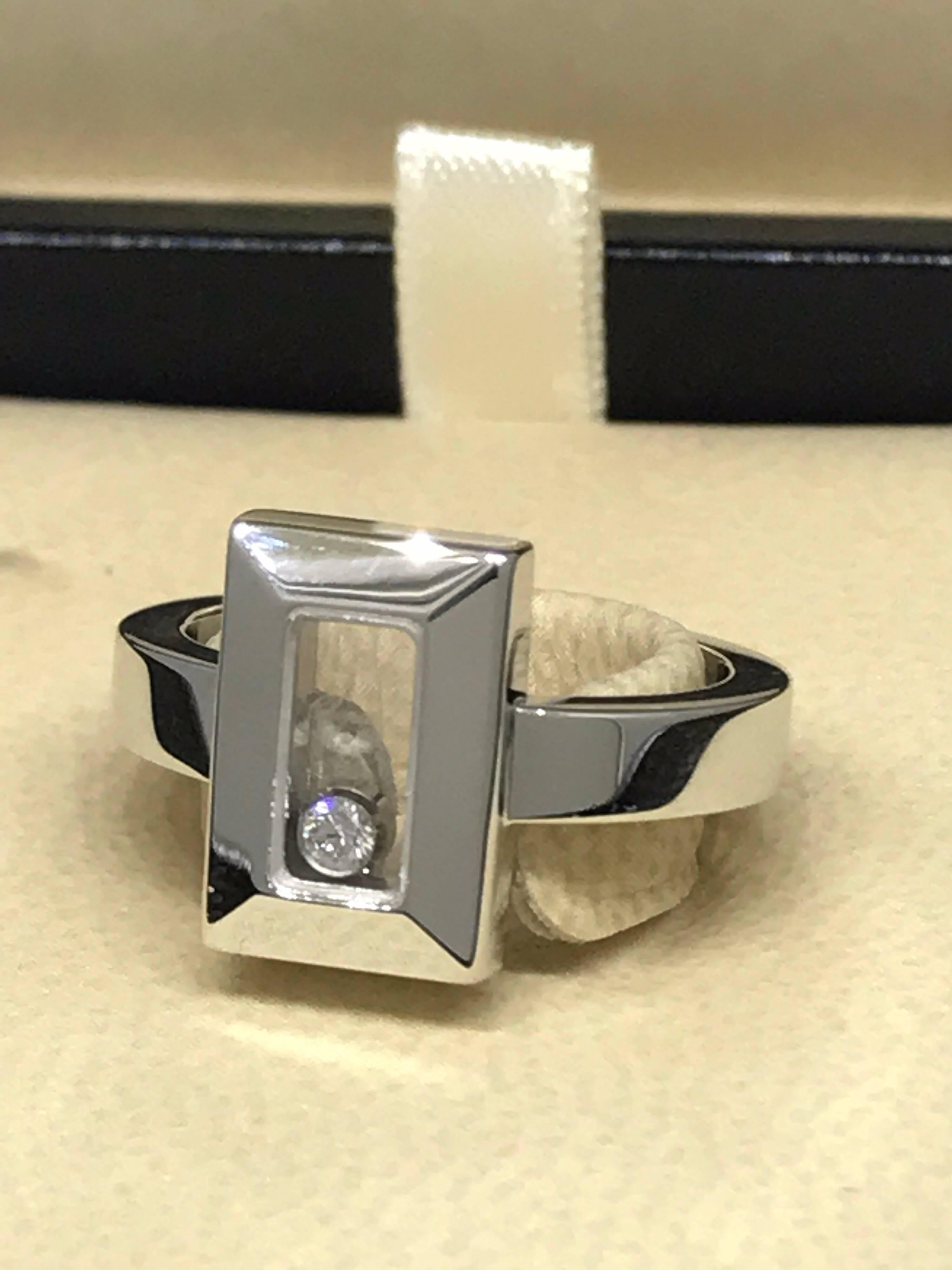 Chopard Happy Diamonds Rectangular Shape Ring

Model Number: 82/6729-1108

100% Authentic

Brand New

Comes with original Chopard box, certificate of authenticity and warranty, and jewels manual

18 Karat White Gold (8.20gr)

1 Floating Diamond (.05