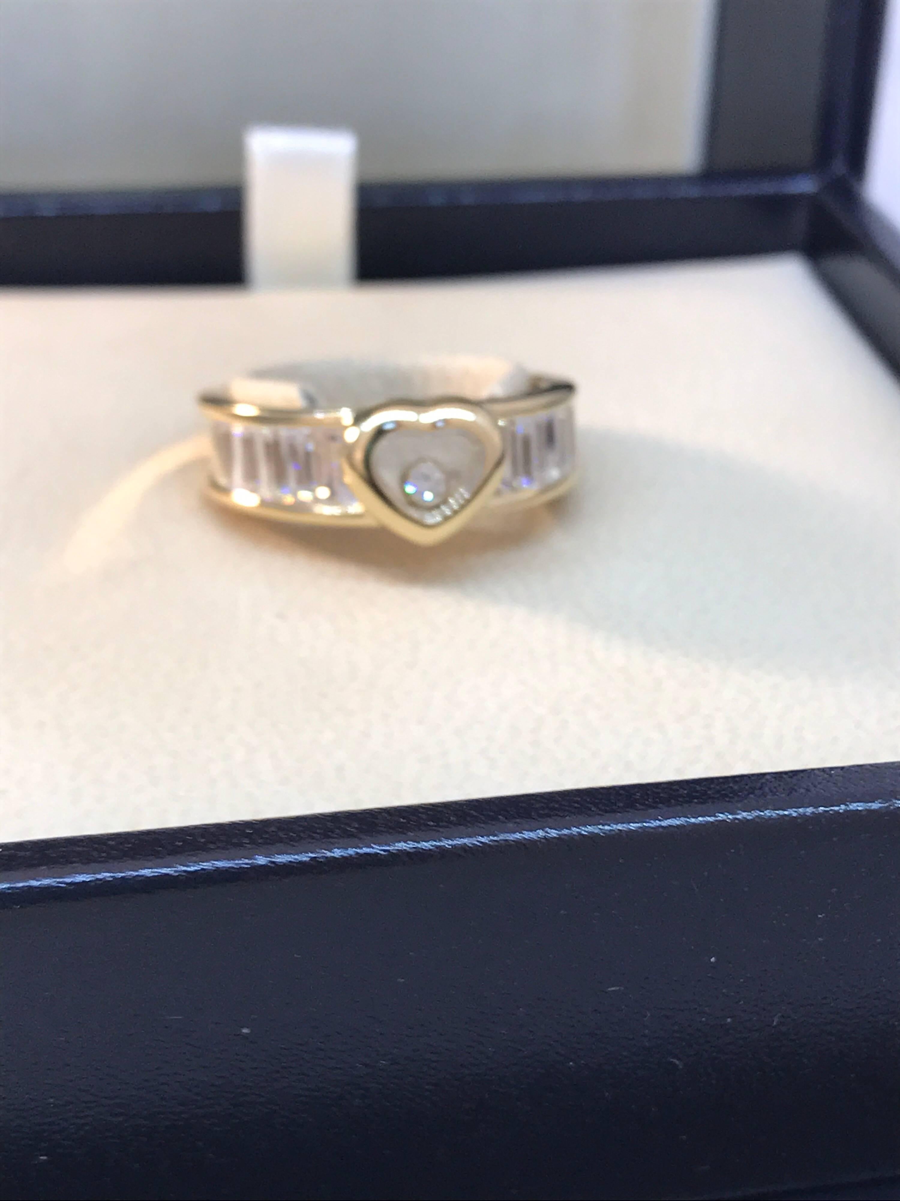 Chopard Happy Diamonds Heart Ring

Model Number: 82/2853-0113

100% Authentic

Brand New

Comes with original Chopard box, certificate of authenticity and warranty, and jewels manual

18 Karat Yellow Gold (8.50gr)

10 Trapeze Diamonds on the ring