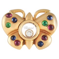 Or jaune 18 carats Happy Diamonds avec diamant 0,05 carat, émeraude et rubis
