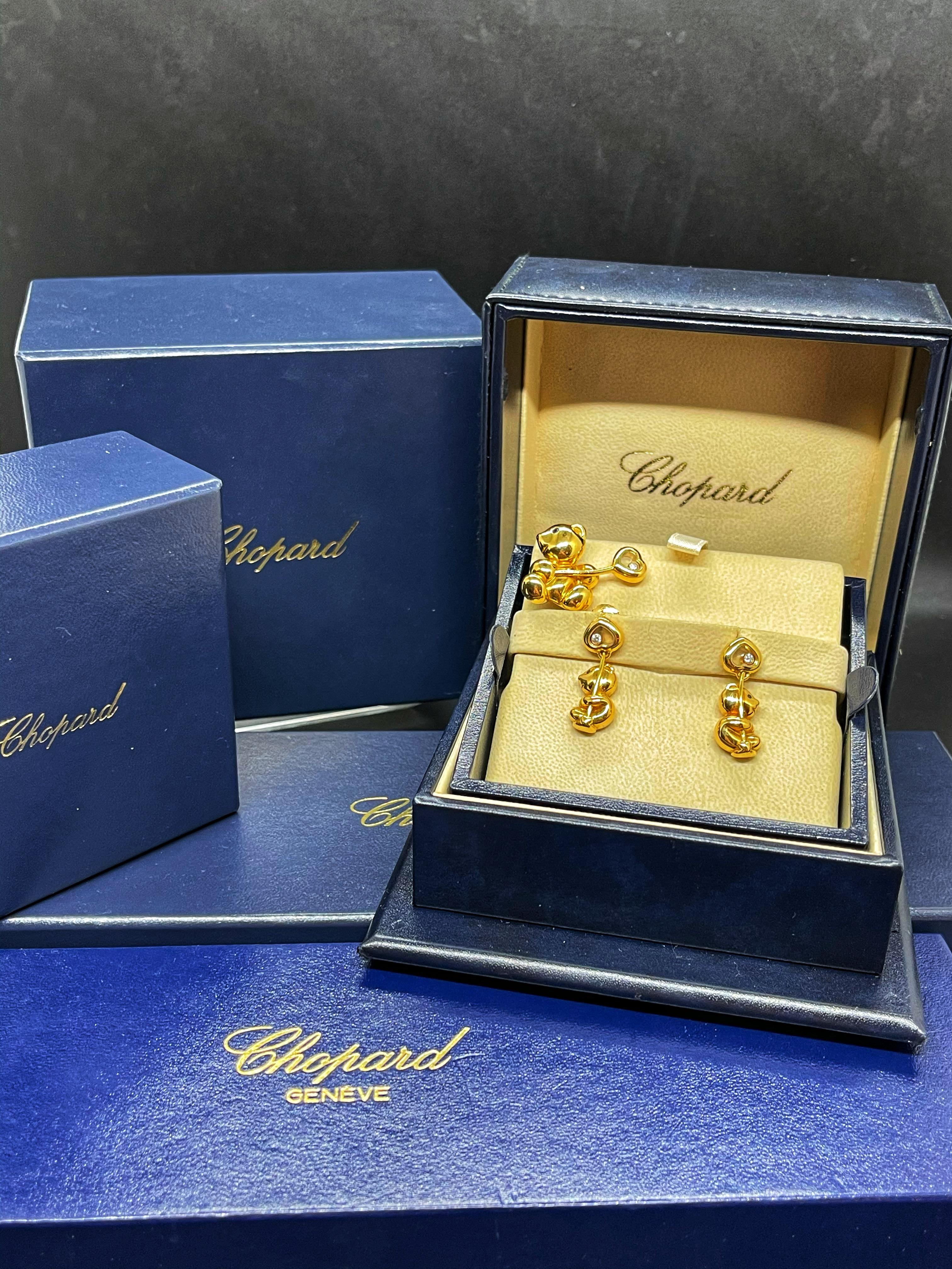 An extremely rare 18 K diamond set, designed by Chopard with earrings and pendant, which makes a part of the timeless Happy Diamonds collection designed in the shape of the bears with balloons. This set combines an original design and classical