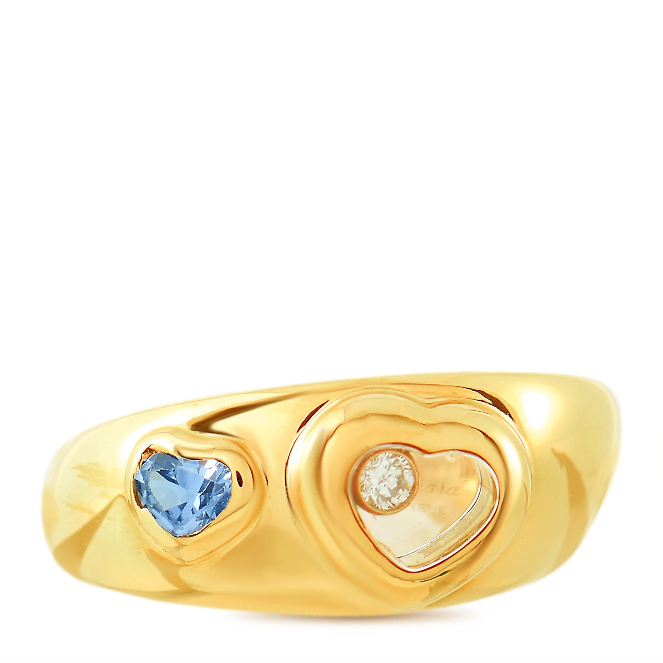 The Chopard “Happy Diamonds” ring is made of 18K yellow gold and embellished with a floating diamond and a heart-shaped aquamarine. The ring weighs 9 grams and boasts band thickness of 5 mm and top height of 4 mm, while top dimensions measure 9 by