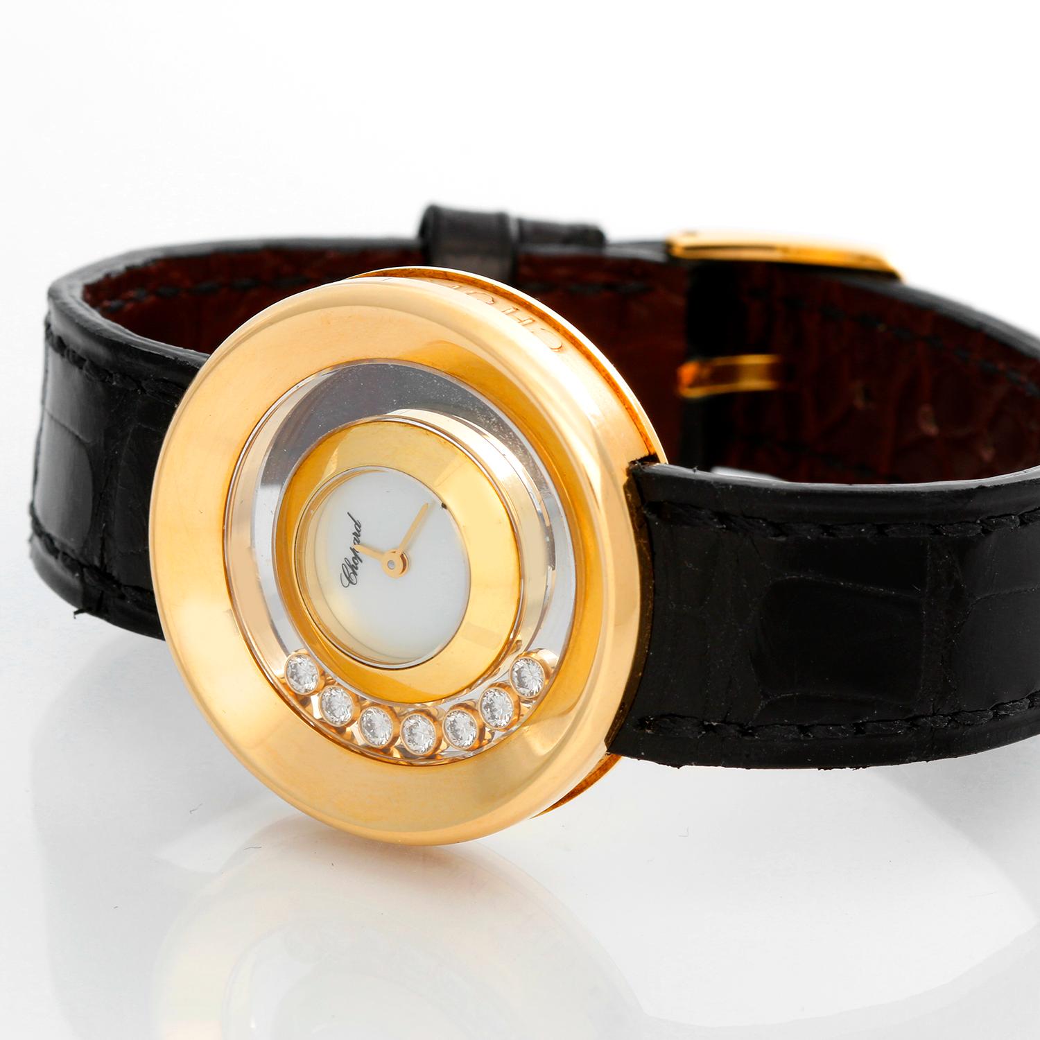 Chopard Happy Diamonds 18K Yellow Gold Ladies Watch - Quartz. 18K yellow gold case with 7 floating diamonds (31mm). Mother of pearl dial . Black strap with tang buckle . Pre-owned with custom box