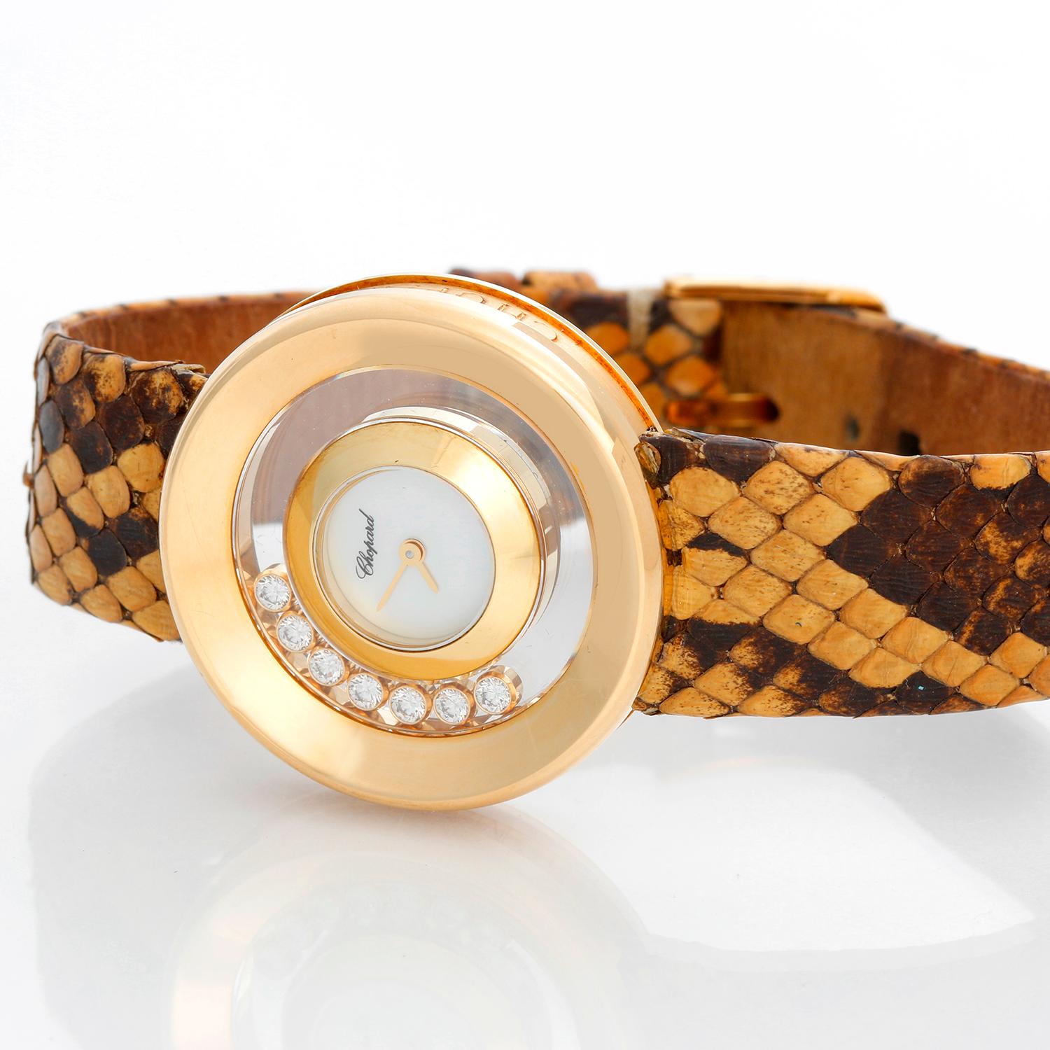 Chopard Happy Diamonds 18K Yellow Gold Ladies Watch - Quartz. 18K yellow gold case with 7 floating diamonds (31mm). Mother of pearl dial . Brown snakeskin strap with tang buckle . Pre-owned.