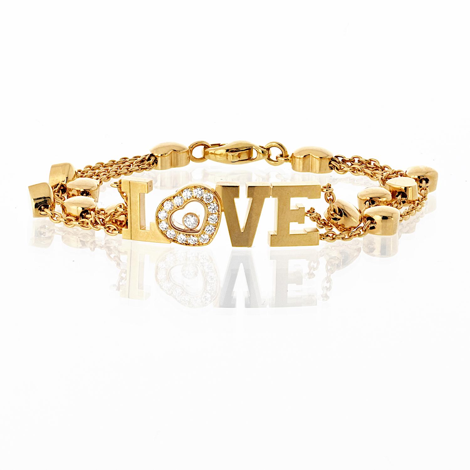 A charming expression of elegance and affection, this Chopard Happy Diamonds Love Bracelet is crafted in 18K yellow gold and features the iconic 