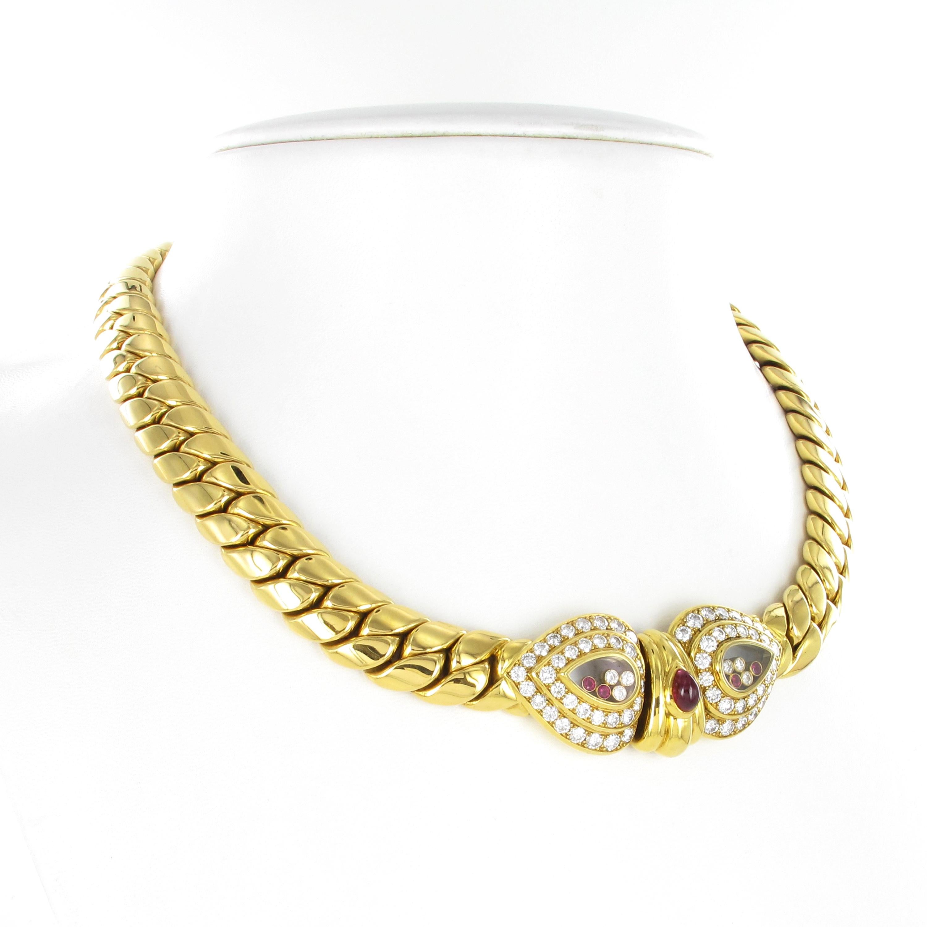 One of a kind Chopard Happy Diamonds necklace in 18 karat yellow gold. The massiv necklace is set with a total of 72 full brilliant-cut diamonds totalling approximate 2.90 ct. Center set with one pear-shape cabochon ruby of approximate 1.20 ct. and