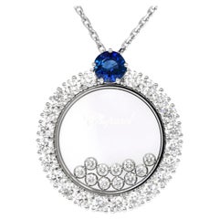 Chopard Happy Diamonds: 18 Karat Gold Halskette mit Kreis-Anhänger mit blauem Saphir