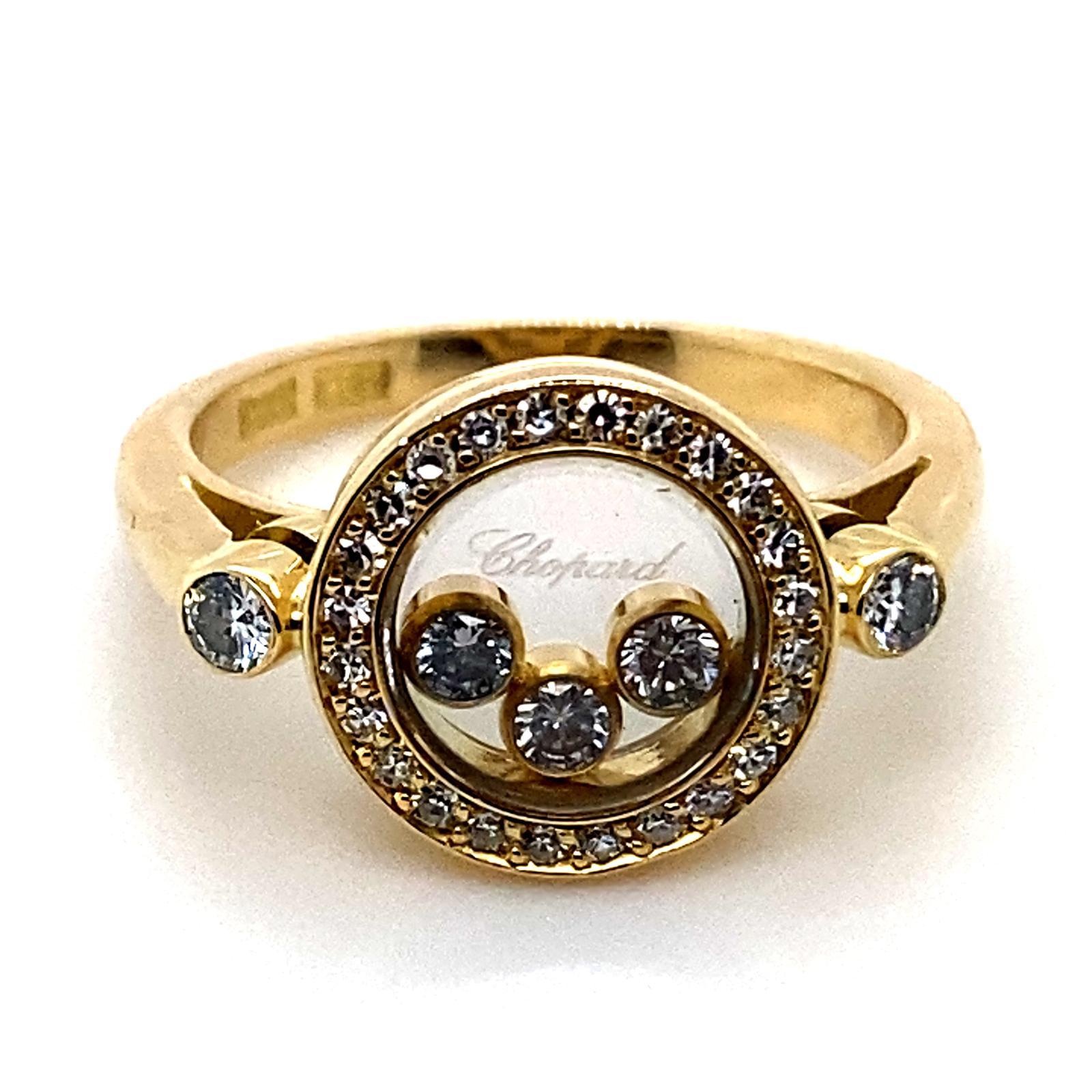 A Chopard Happy Diamonds circle 18 karat yellow gold ring.

This circular shaped ring is from Chopard's signature Happy Diamond collection.

The ring contains three of Chopard's iconic floating diamonds set within a fine bezel of 18 karat yellow