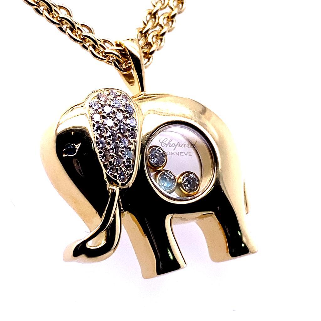 A Chopard Happy Diamonds elephant 18 karat yellow gold pendant and chain.

This fun pendant in the cartoon form of an elephant is from Chopard's signature Happy Diamonds collection.

Featuring a pavé set diamond ear, a sapphire set eye and  three of