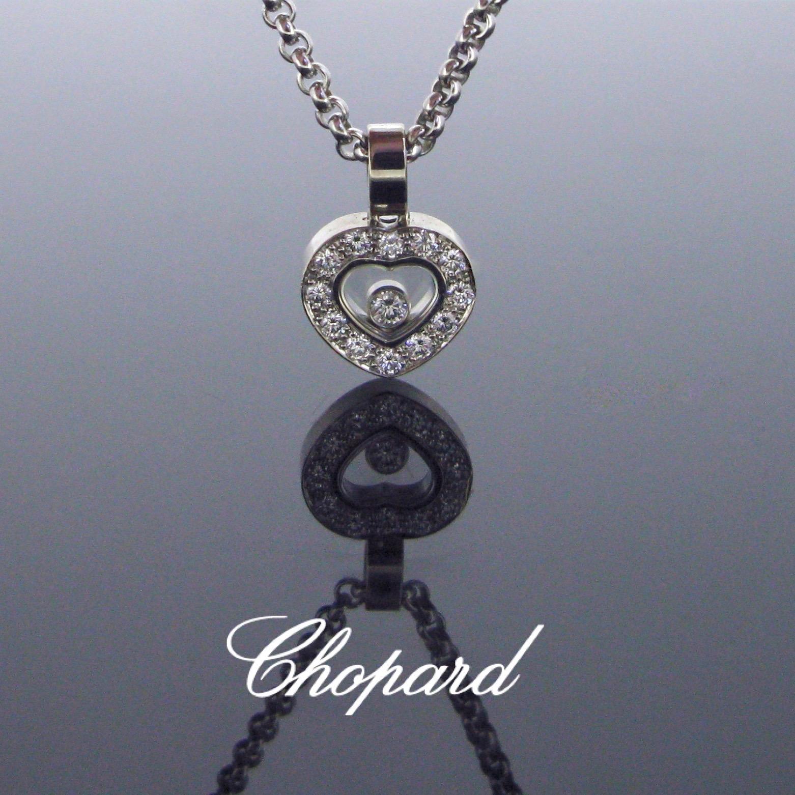 This pendant necklace is an instant classic of Chopard collection. The pendant has a heart shape design and it contains a floating diamond. The heart is adorned with 12 brilliant cut diamonds. The signature Chopard is legible on the glass and also