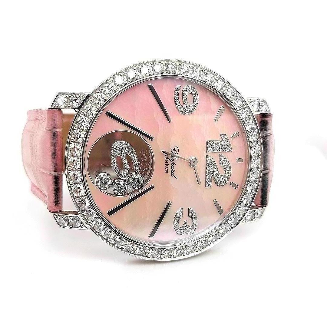 Chopard Happy Diamonds Happy Time Full Diamonds Set White Gold with mother of pearl dial.

Exceptional and Rare Solid 18 kt white gold fully diamond set by Chopard.
Even the numbers on the Mother of Pearl Dial are diamond set.

Dial : Mother of