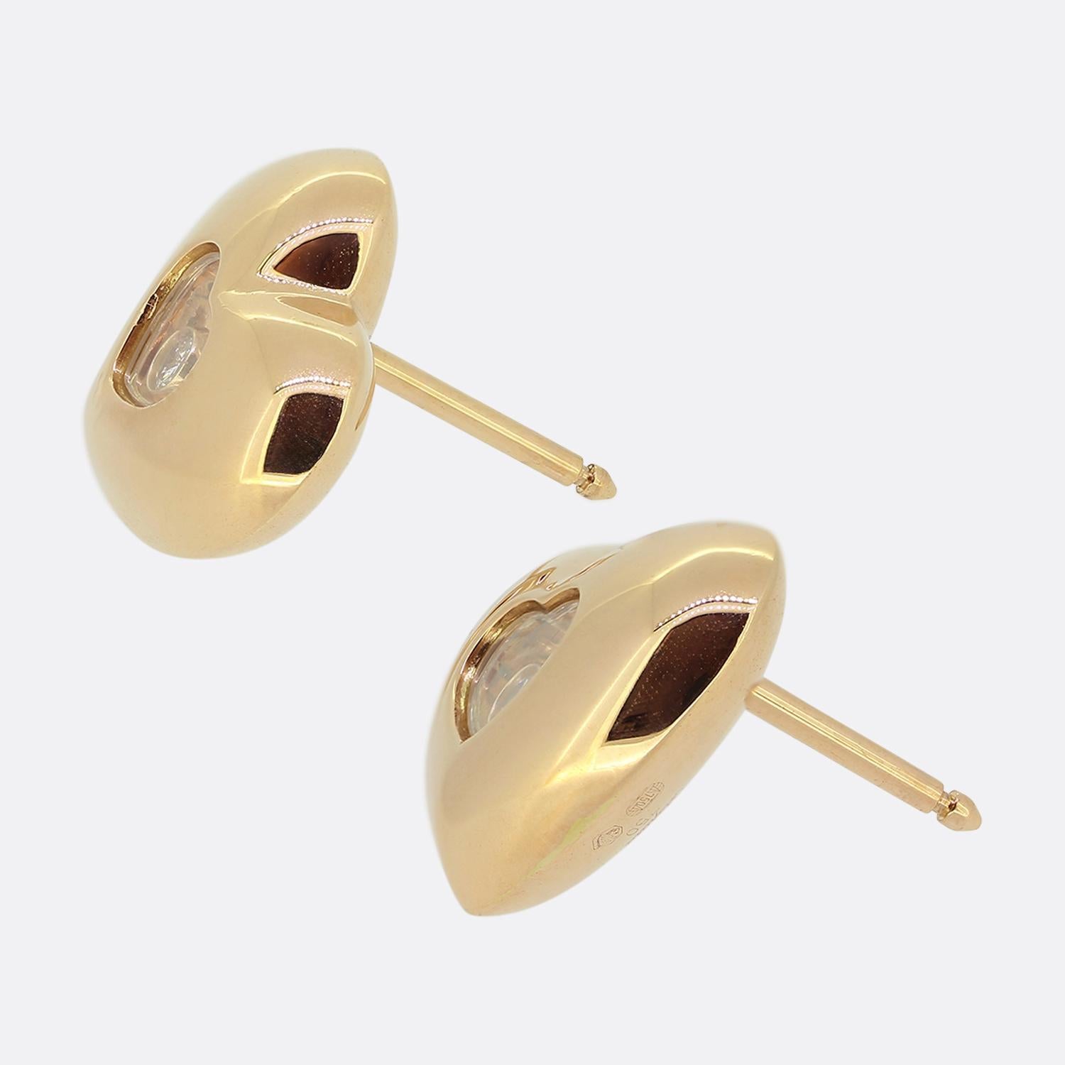 Here we have a pair of 18ct rose gold earrings from Chopard's 'Happy Diamonds' collection. The heart shaped earrings have a single floating diamond encased inside the central crystal glass.

Condition: Used (Very Good)
Total Weight: 8.4 grams
Heart