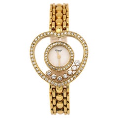 Chopard Montre Happy Diamonds en or jaune avec quartz en forme de cœur et lunette en diamant 