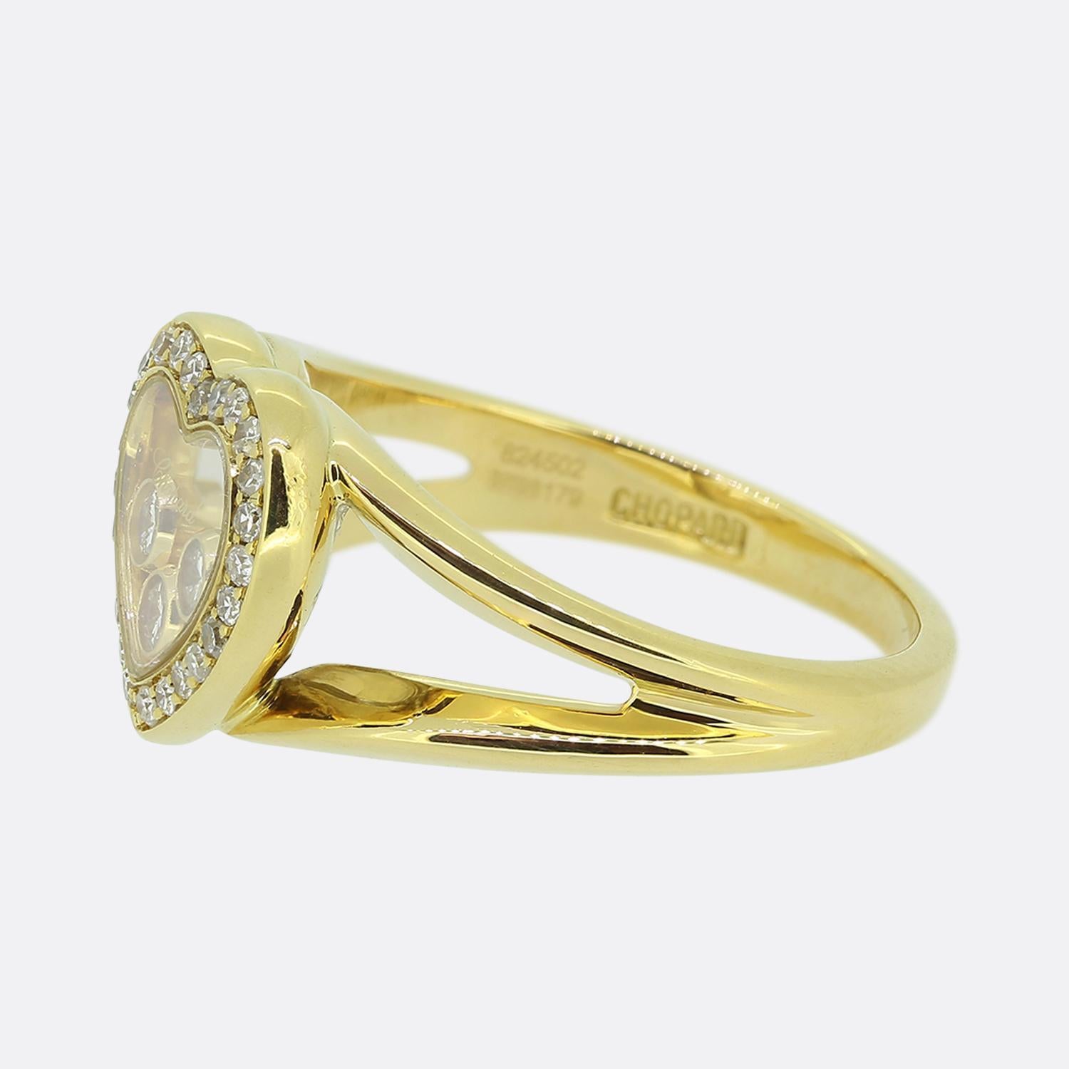 Here we have a romantic diamond ring from the world renowned French jewellery designer Chopard. This piece has been crafted from 18ct yellow gold and forms part of their iconic Happy Diamonds collection. The face takes on a love heart design with