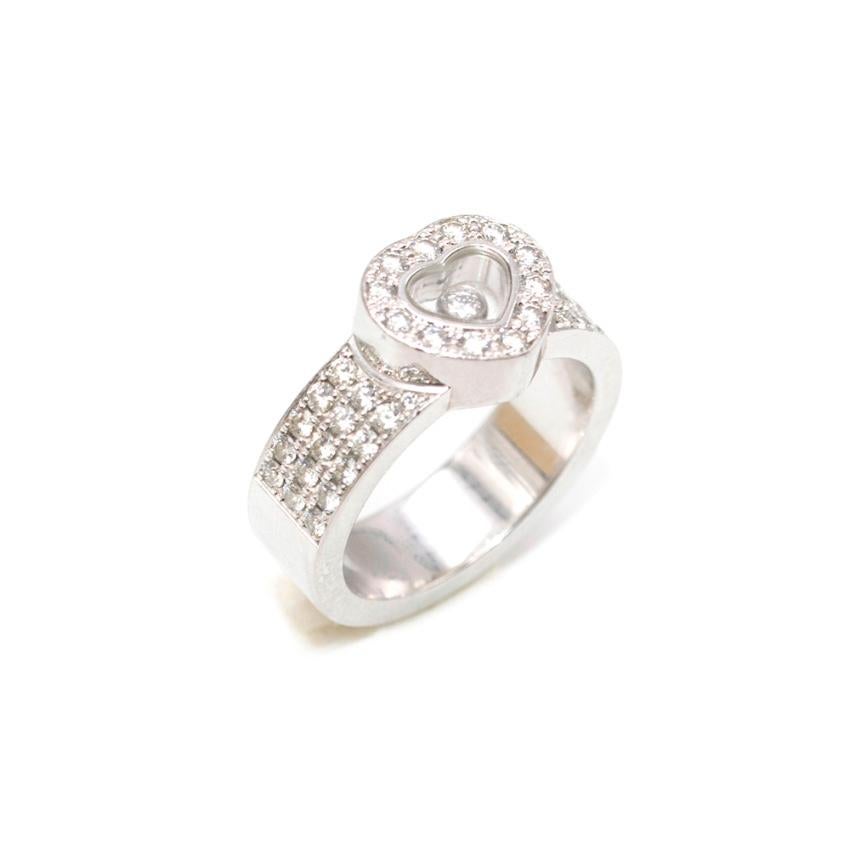 Chopard - Happy diamonds heart ring 

18k white gold - pave diamonds across the band and heart - heart shape with single floating diamond - Carat total is 0.74

Please note, these items are pre-owned and may show signs of being stored even when