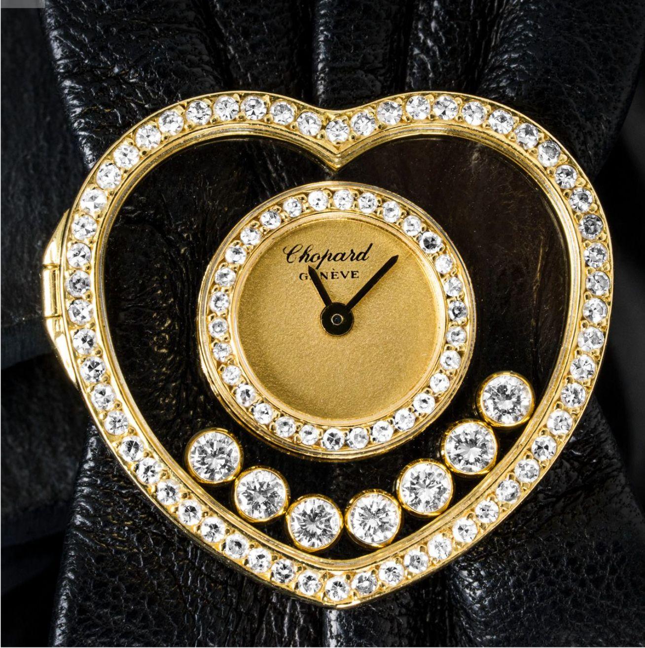A ladies Happy Diamonds wristwatch crafted in yellow gold by Chopard. Featuring a champagne dial with a distinctive yellow gold bezel shaped like a heart. The watch also features 7 floating diamonds and a total of 86 round brilliant cut diamonds.