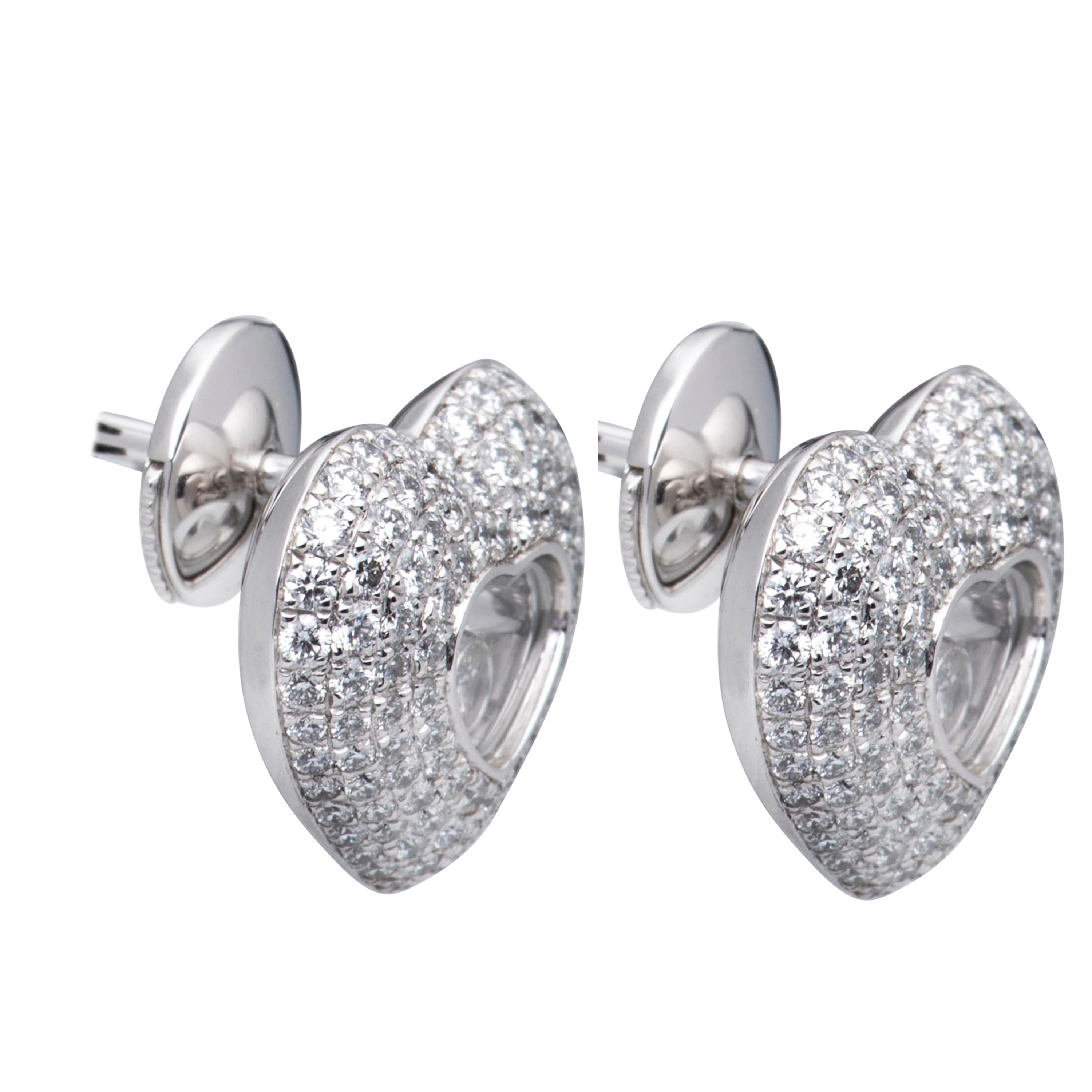 Chopard Happy Diamonds Heart Earrings

Model Number: 83/7417-1001

100% Authentic

Brand New

Comes with original Chopard box, certificate of authenticity and warranty, and jewels manual

18 Karat White Gold (6.70gr)

214 Diamonds total on the