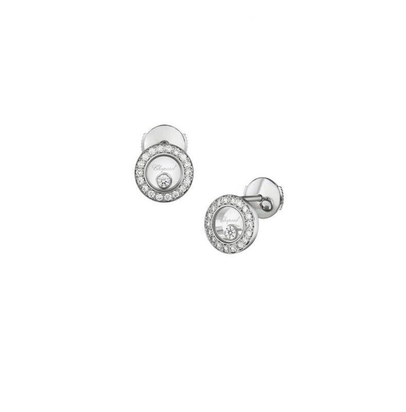 Chopard  HAPPY DIAMONDS ICONS EARRINGS PINS WITH 18-carat white gold and diamonds.  Inspired by sparkling drops of water in a waterfall, the freely-moving diamond held between two sapphire crystals on this new diamond-set round-shaped ear pins in