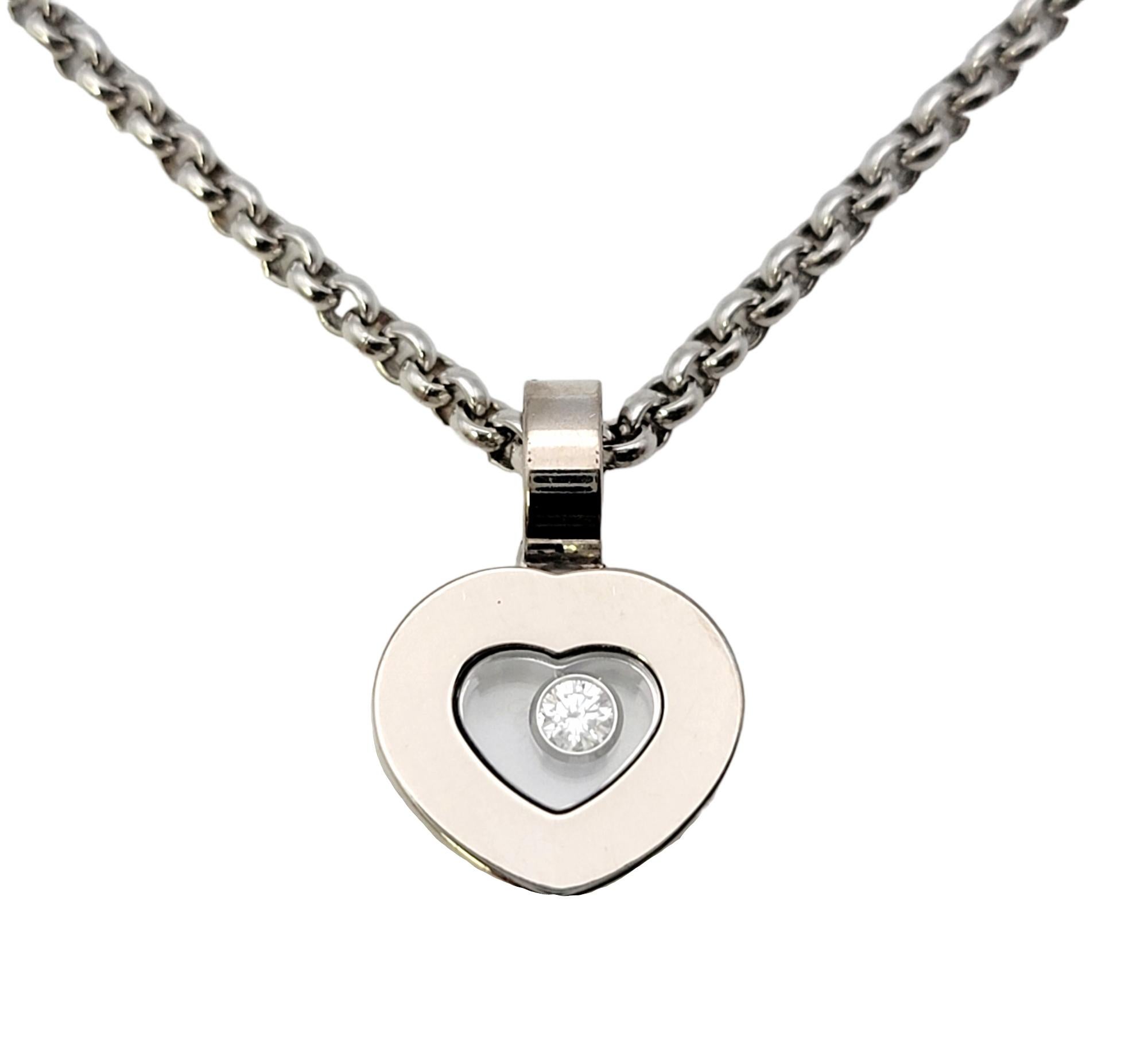 Simple yet elegant heart pendant with a playful floating diamond detail by French designer, Chopard. Part of the 'Happy Diamonds Icons' collection, this unique necklace offers understated sparkle and shine with a chic twist. You will love this