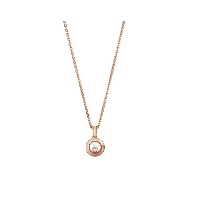 Chopard HAPPY DIAMONDS ICONS PENDANT with 18k rose gold and diamond.  Inspired by sparkling drops of water in a waterfall, the freely-moving diamond held between two sapphire crystals on this new round-shaped pendant in 18K rose gold swirls and