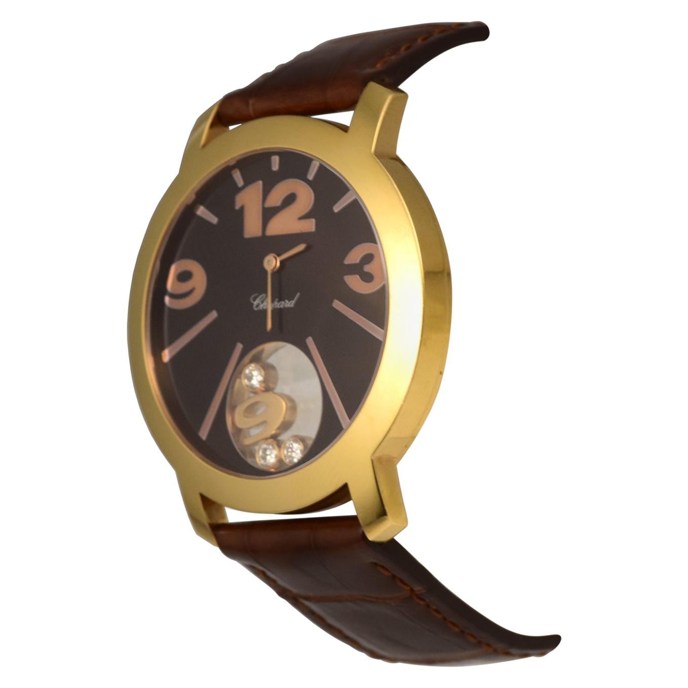 Brand: Chopard
Model Name:  Happy Diamond
Movement: Quartz
Case Size: 40 mm
Case Back: Solid
Case Material: Rose Gold 
Bezel: Rose Gold 
Dial: Chocolate 
Bracelet:  Brown Alligator Leather 
Hour Markers:  Arabic Numerals  
Features: Hours, Minutes,
