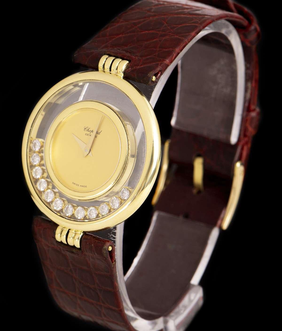  A 31 mm  18k Yellow Gold Happy Diamonds Ladies Wristwatch, champagne dial, a fixed 18k yellow gold inner bezel, a fixed 18k yellow gold outer bezel, 12 floating rubover round brilliant cut diamonds in between both bezels, an original maroon leather