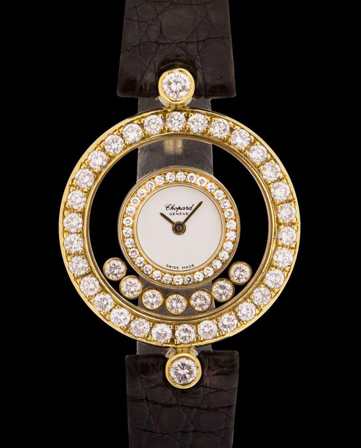 An 18k Yellow Gold Happy Diamonds Ladies 26mm Wristwatch, silver dial, a fixed 18k yellow gold inner bezel set with 30 round brilliant cut diamonds, 7 floating rubover round brilliant cut diamonds, a fixed 18k yellow gold outer bezel set with 30