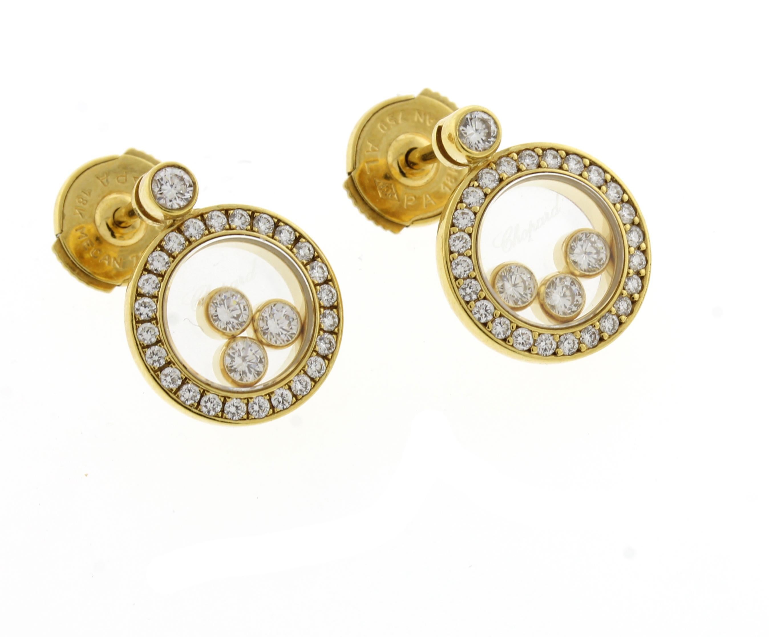 From Chopard a pair of round drop happy diamond earrings.
•  Chopard
•  18 karat gold
• Circa: 2015 
• Size: 11.5mm in diameter 
• 56 diamonds weigh .72 carats
• Pampillonia box	
  
 