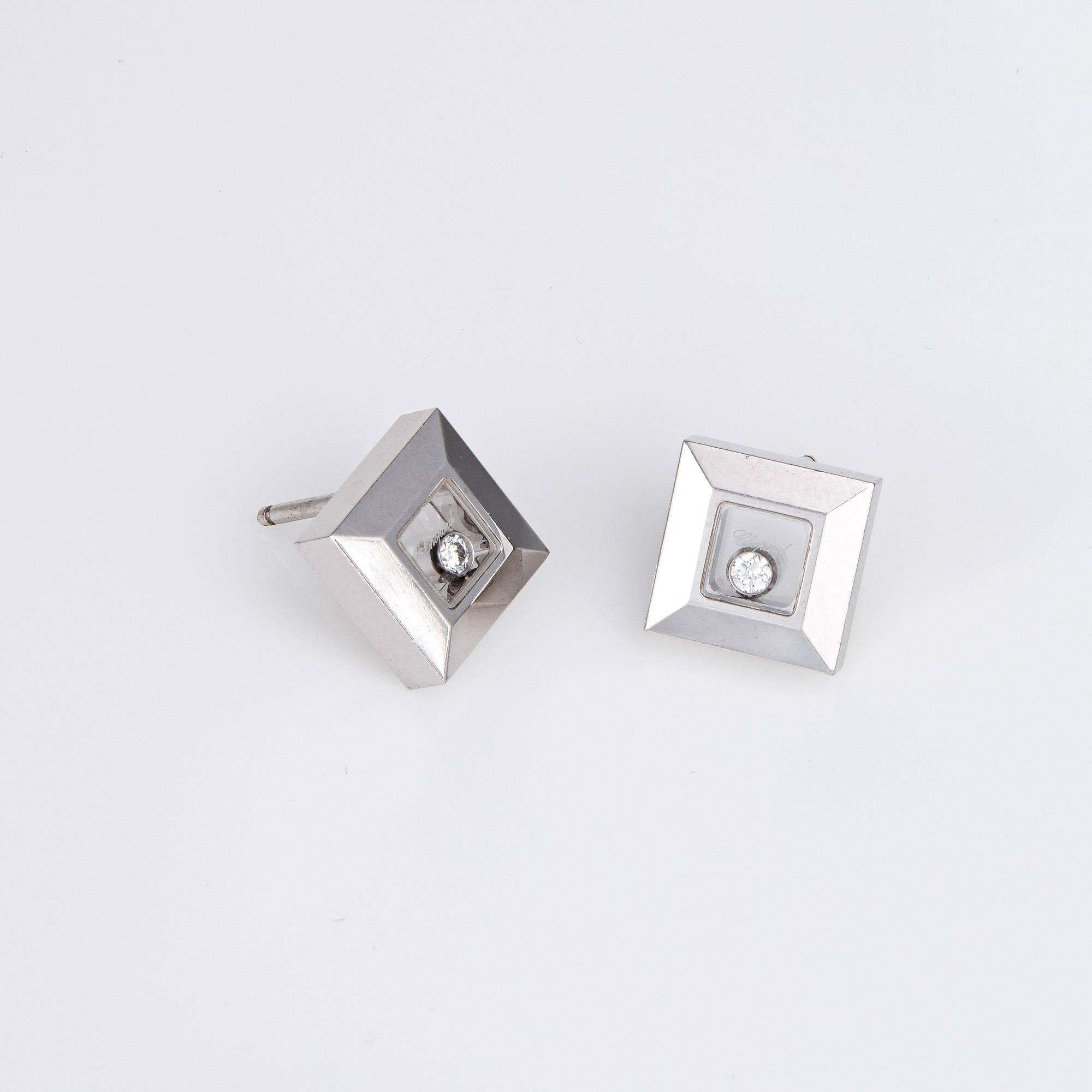 Elegant pair of pre-owned Chopard Happy Diamonds square stud earrings (circa 2010) crafted in 18k white gold. 

Round brilliant cut diamonds total 0.11 carats (estimated at G-H color and VS2 clarity). 

The square stud earrings are set with floating