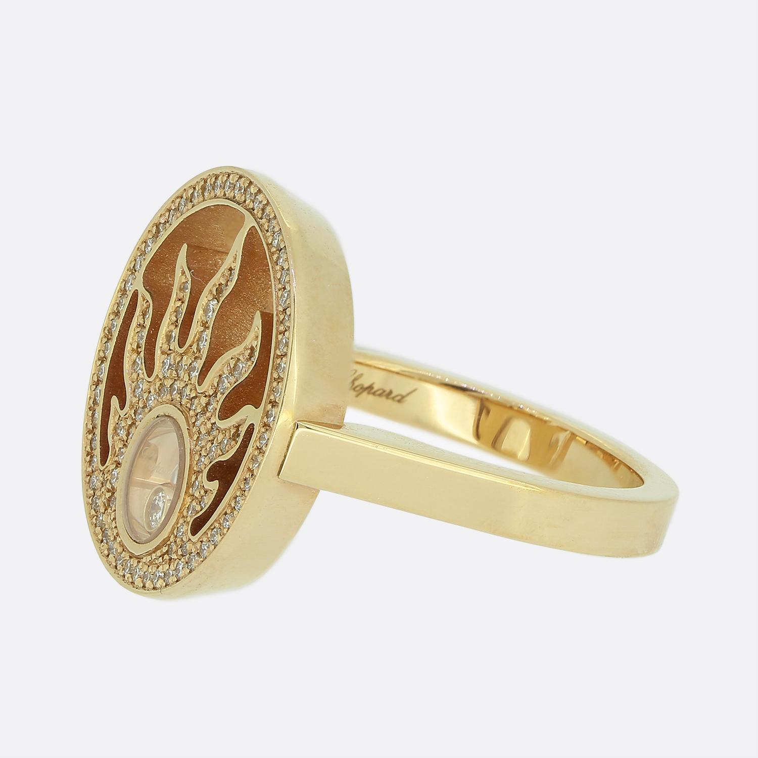 Here we have a dazzling diamond ring from the world renowned French jewellery designer Chopard. This piece has been crafted from 18ct rose gold and forms part of their iconic Happy Diamonds collection. The face takes on a round design whilst
