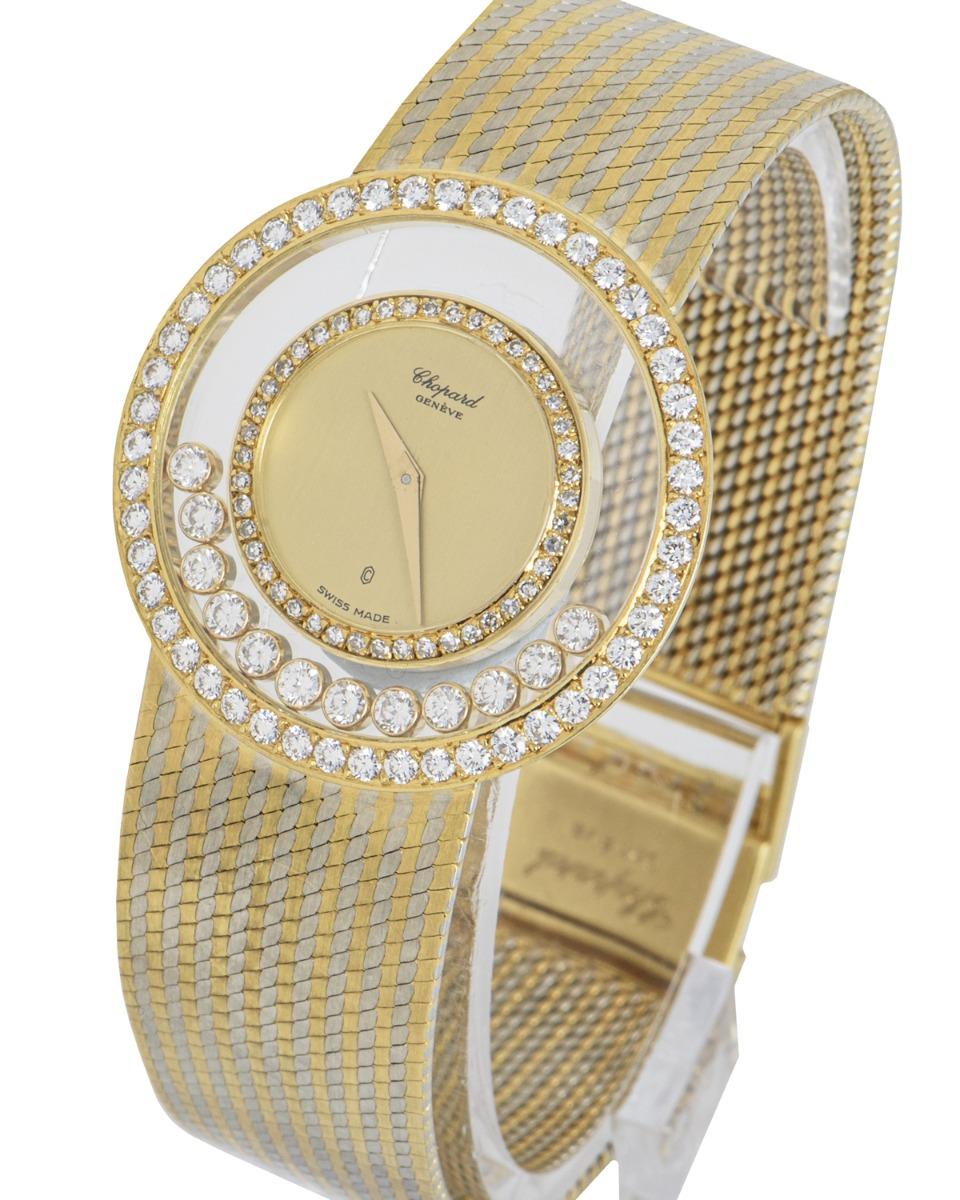 A classic ladies' happy diamonds cocktail wristwatch 32mm, crafted in 18k yellow gold and white gold by Chopard. Featuring a distinctive champagne dial surrounded by 44 single cut diamonds (~0.40ct), 12 floating diamonds, and 48 round brilliant