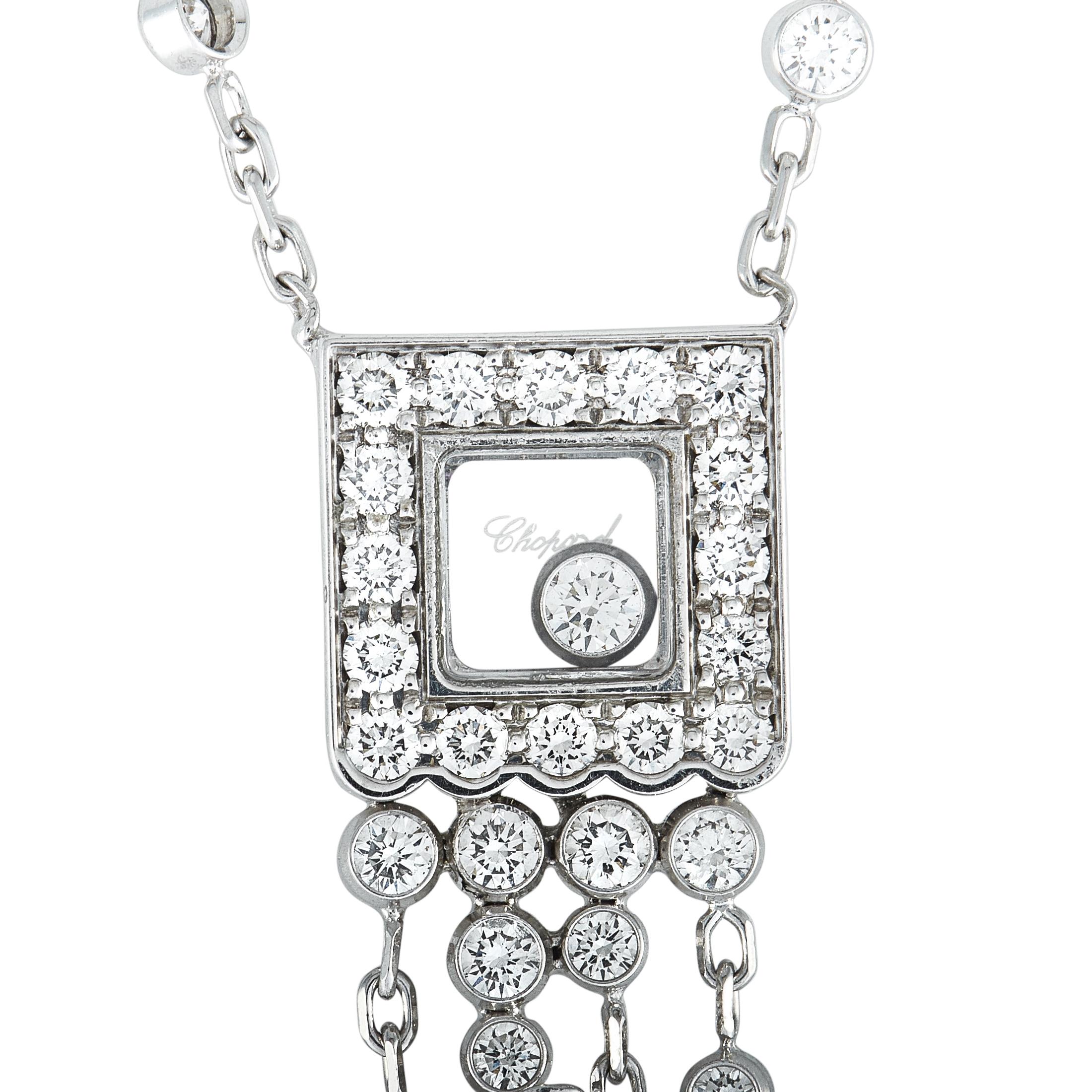The Chopard “Happy Diamonds” necklace is crafted from 18K white gold, boasting a 14” chain with lobster claw closure and a pendant that measures 3.25” in length and 0.37” in width. The necklace weighs 10.5 grams and is set with a total of 1.63
