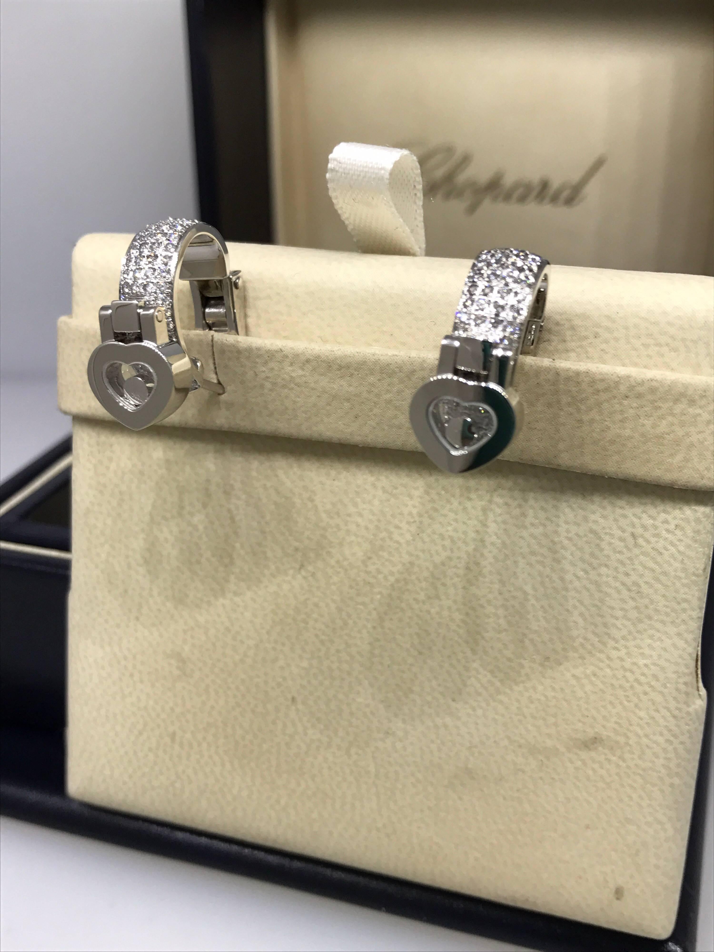 Chopard Happy Diamonds Heart Earrings

Model Number: 84/6987-1001

100% Authentic

Brand New

Comes with original Chopard box, certificate of authenticity and warranty, and instruction manual

18 Karat White Gold (14.8gr)

184 Diamonds Total on the
