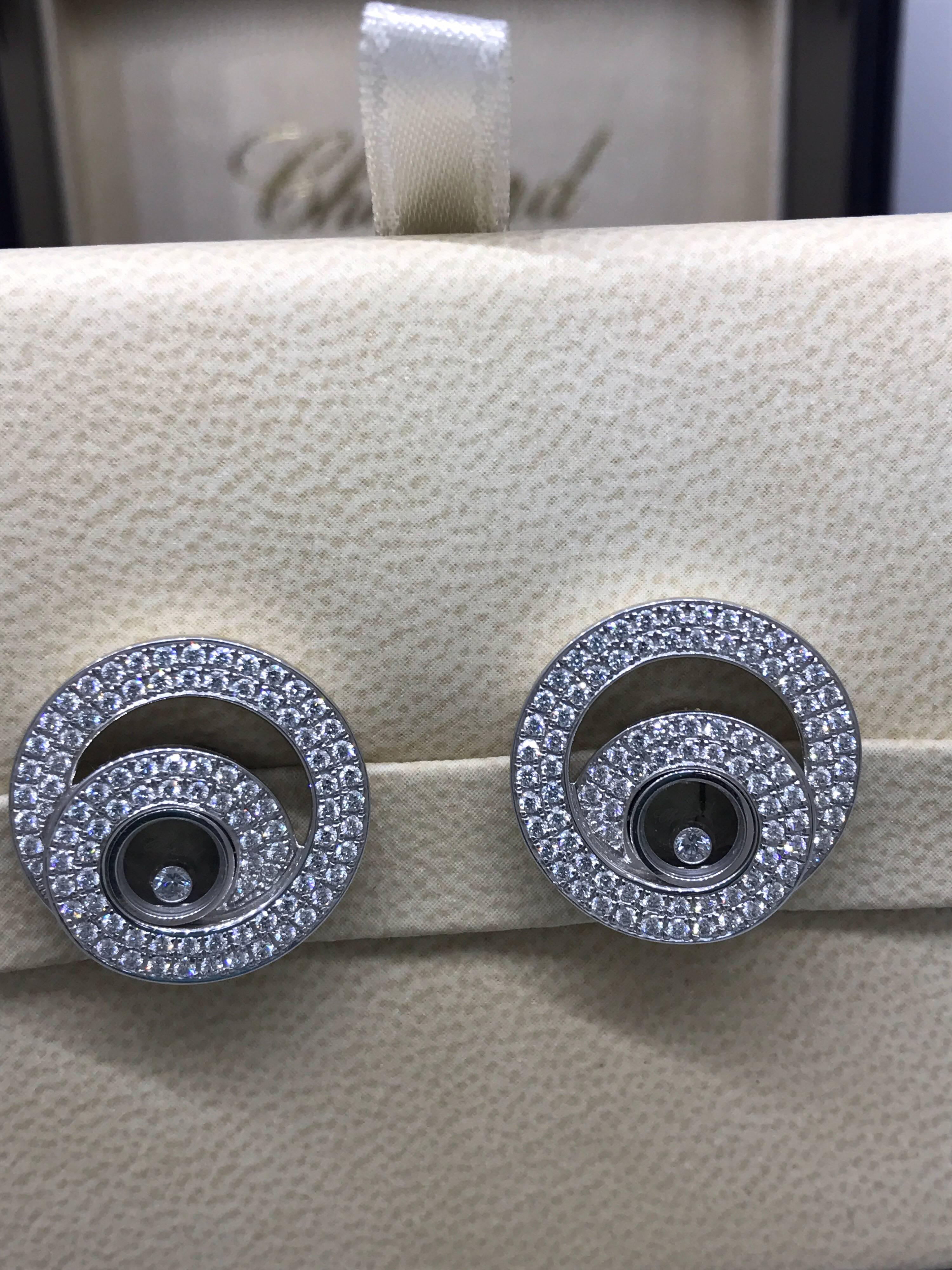 Chopard Happy Diamonds Earrings

Model Number: 83/7109-1001

100% Authentic

Brand New

Comes with original Chopard box, certificate of authenticity and warranty, and jewels manual

18 Karat White Gold

186 Diamonds Total on the Earrings (1.46