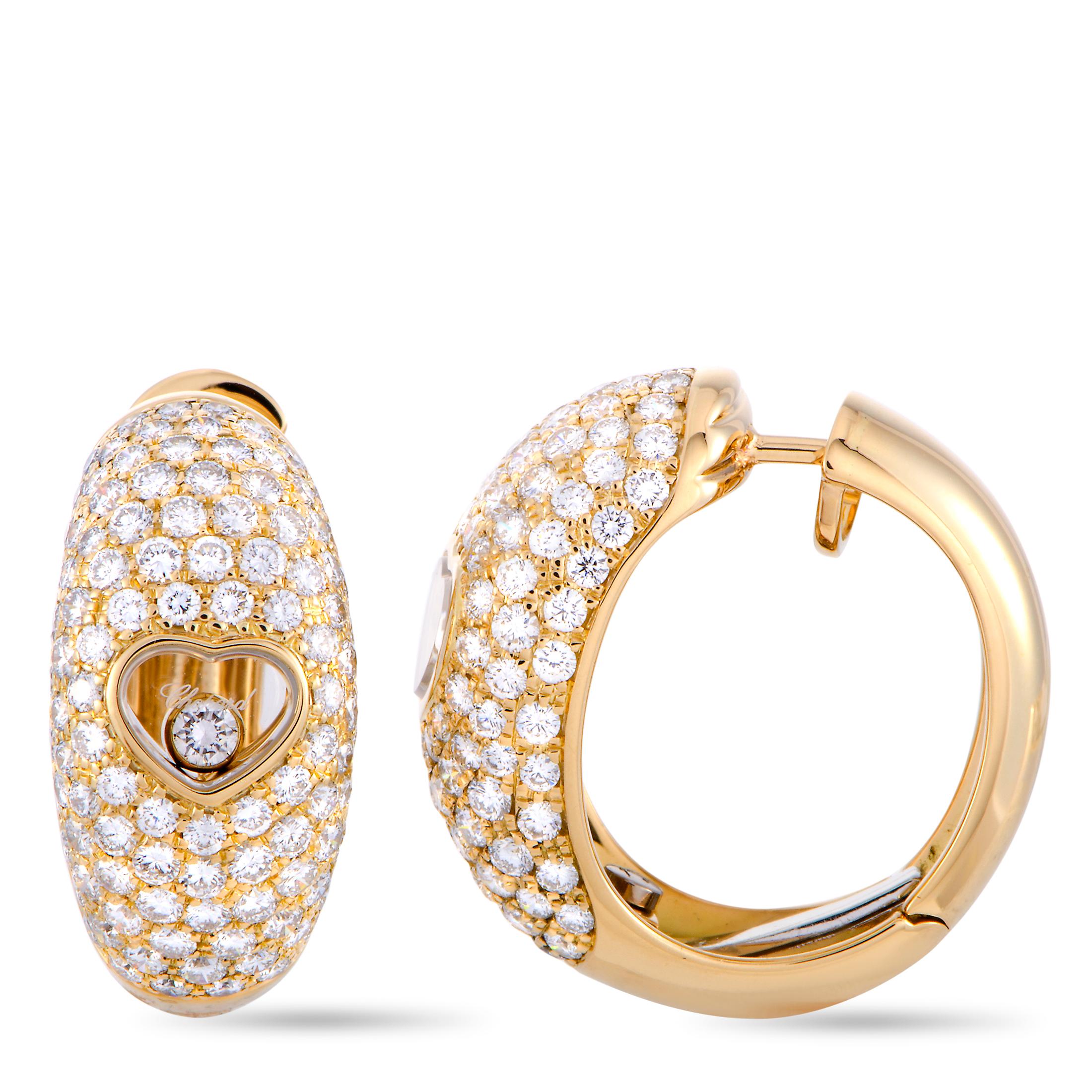 The Chopard “Happy Diamonds” earrings are crafted from 18K yellow gold and set with a total of 3.23 carats of diamonds that feature F-G color and IF-VVS clarity (the two floating stones total 0.11 carats and the remaining stones amount to 3.12