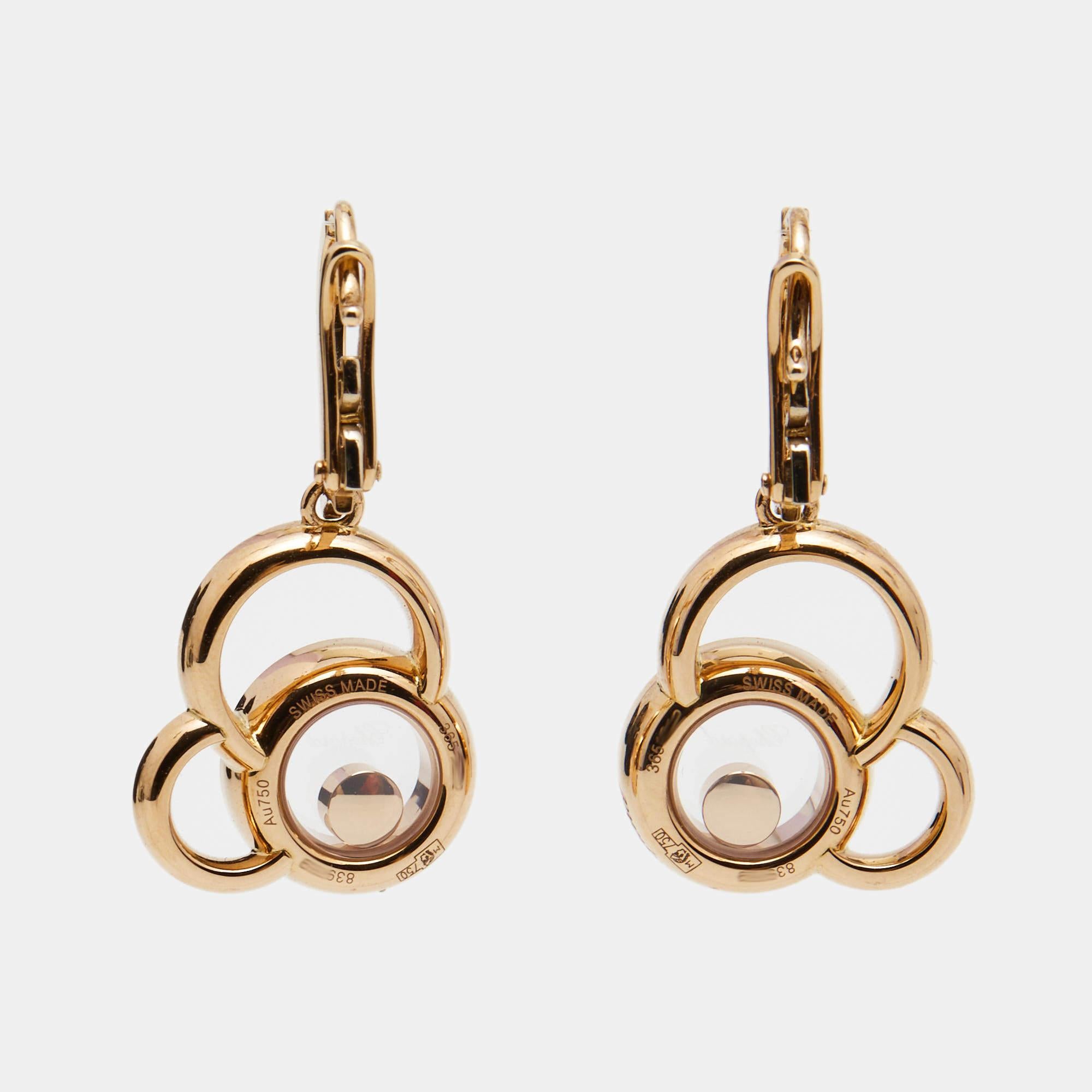 The Chopard Happy Dreams earrings are exquisite and elegant pieces of jewelry. Crafted in luxurious 18k rose gold, they feature a delicate design with a dreamy floating diamond in each earring. These earrings are a perfect blend of sophistication