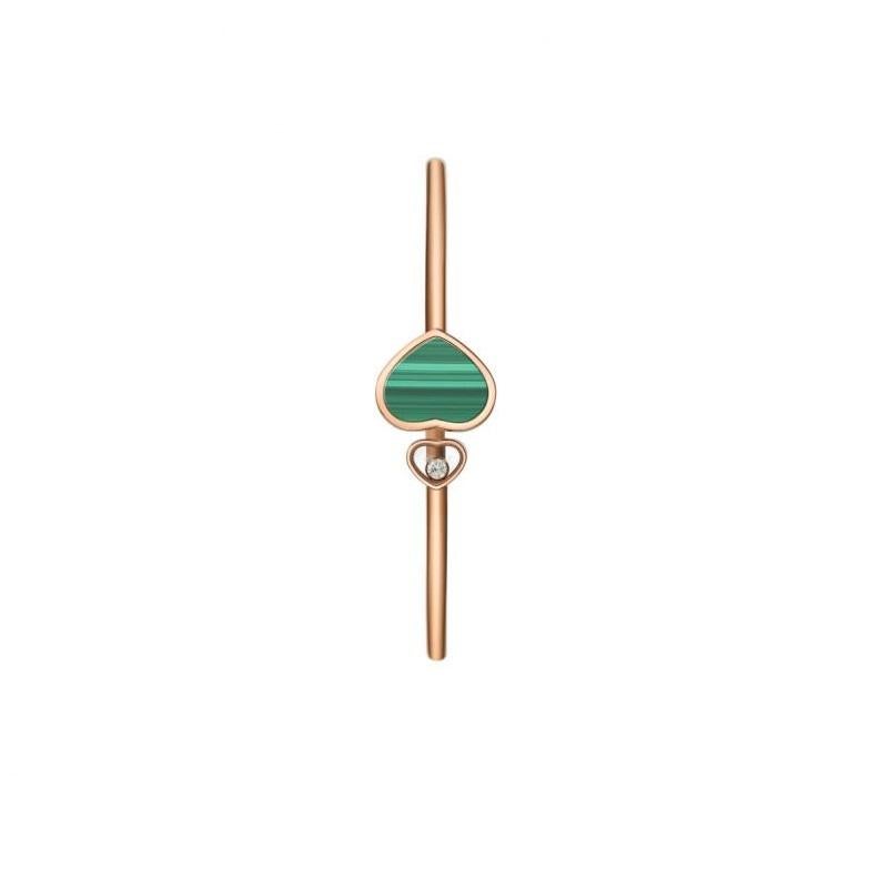 Chopard  HAPPY HEARTS BANGLE with 18k rose gold and natural Malachite.  One Heart cluster with joyful abandon, natural Malachite, all but one which sparkles amongst the rest, framing one of Chopard's signature moving diamonds as it whirls in playful
