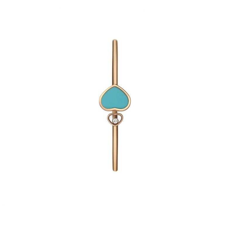 Chopard HAPPY HEARTS BANGLE with 18-carat rose gold and turquoise stone. This timeless bracelet in 18-carat rose gold shines with an elegant heart at either end: a large heart with turquoise stone and a small heart housing one of Chopard's