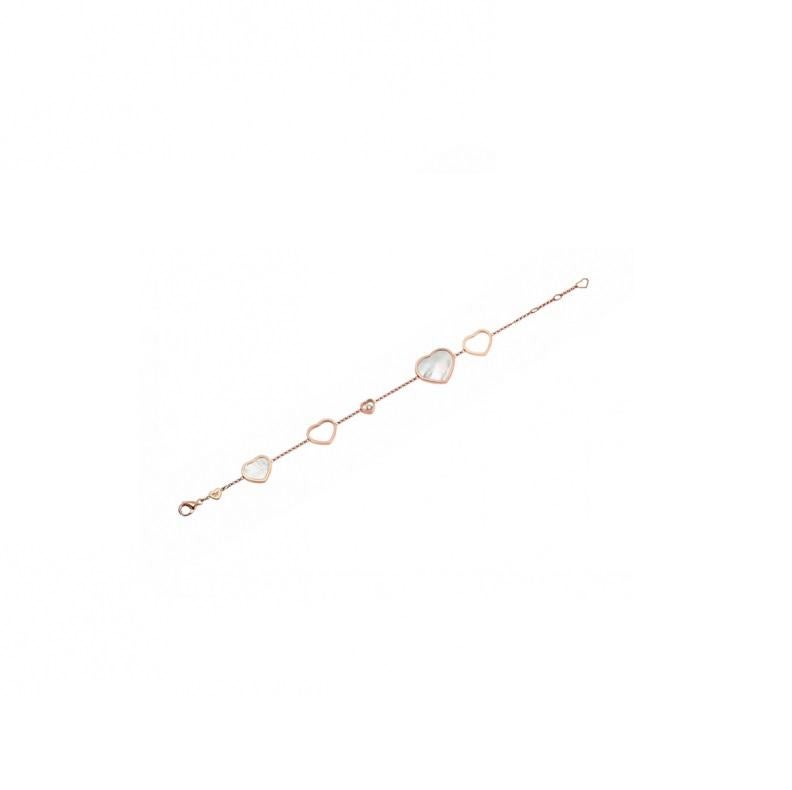 Chopard  HAPPY HEARTS BRACELET with 18-carat rose gold and natural Mother-of-Pearl. This timeless bracelet in 18-carat rose gold shines with elegant hearts contrasting solid and void: natural mother-of-pearl, rose gold openwork and a single moving