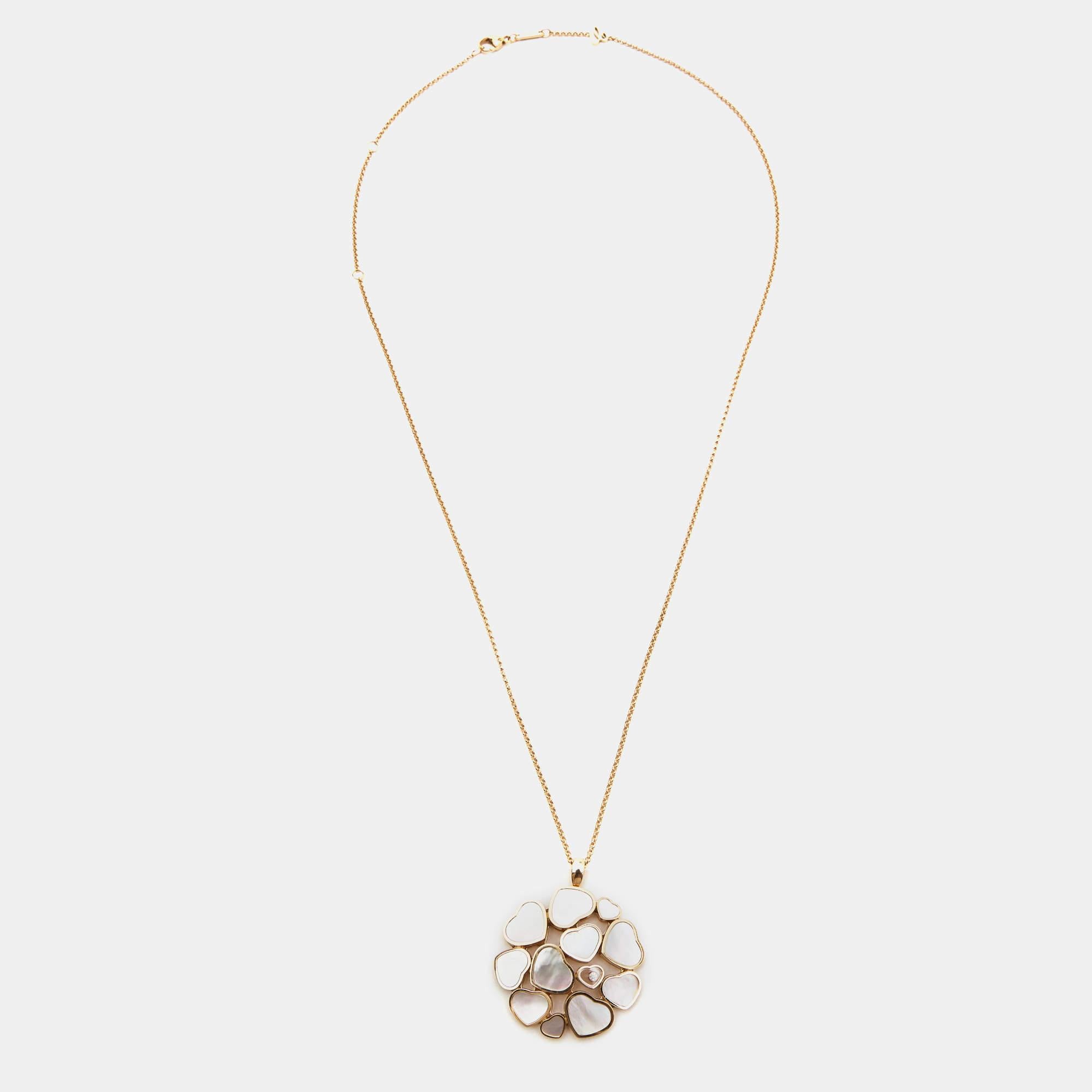 Delicately crafted, the Chopard Happy Hearts necklace exudes timeless grace. Fashioned from 18k rose gold, its pendant features a captivating mother-of-pearl heart embraced by sparkling diamonds, symbolizing love and elegance. This exquisite piece