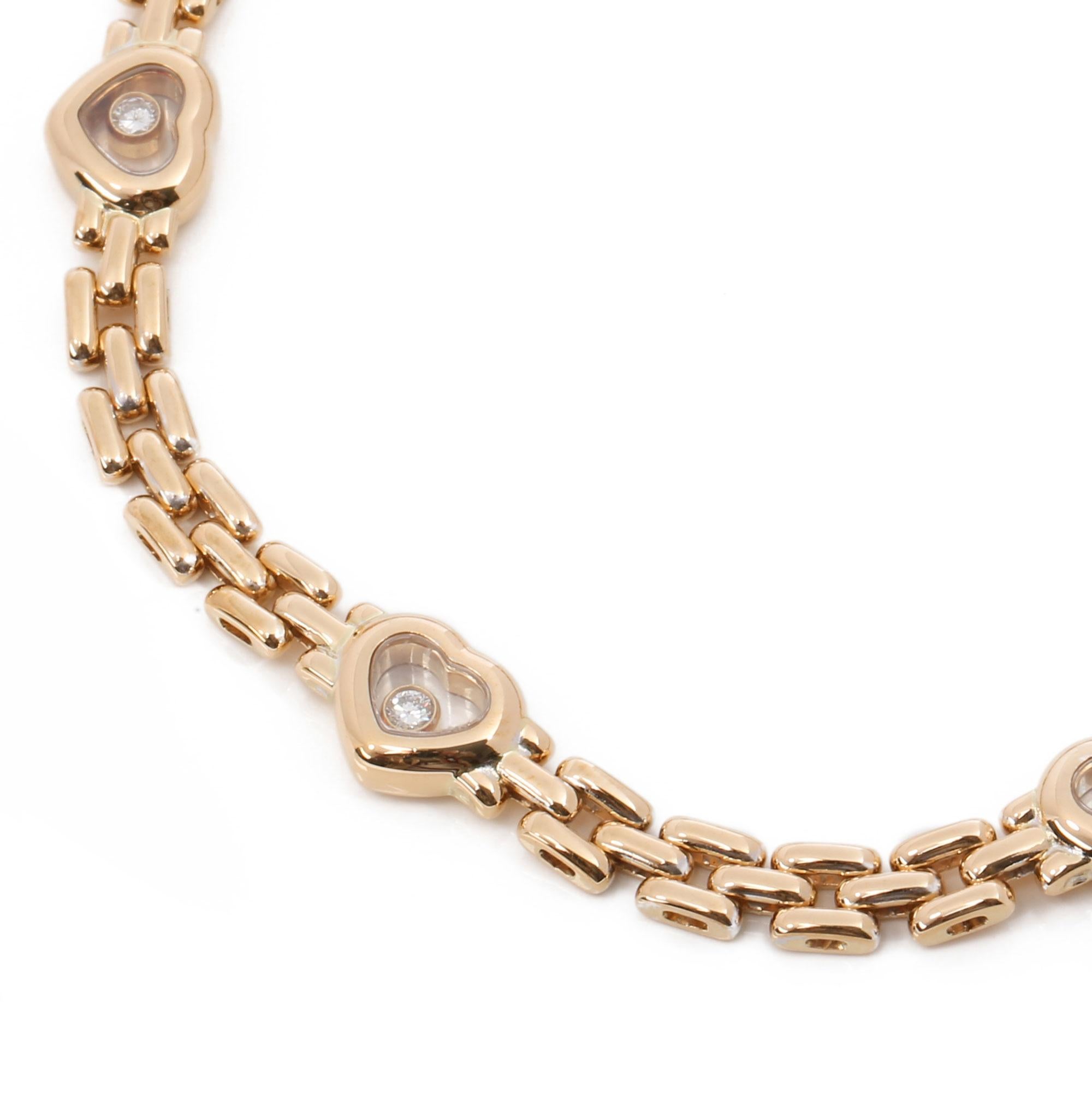 This bracelet by Chopard is from their Happy Hearts collection and features 5 floating diamonds within sapphire crystals, made in 18ct yellow gold. This bracelet has a secure push over clasp. Accompanied with a Xupes presentation box. Our Xupes