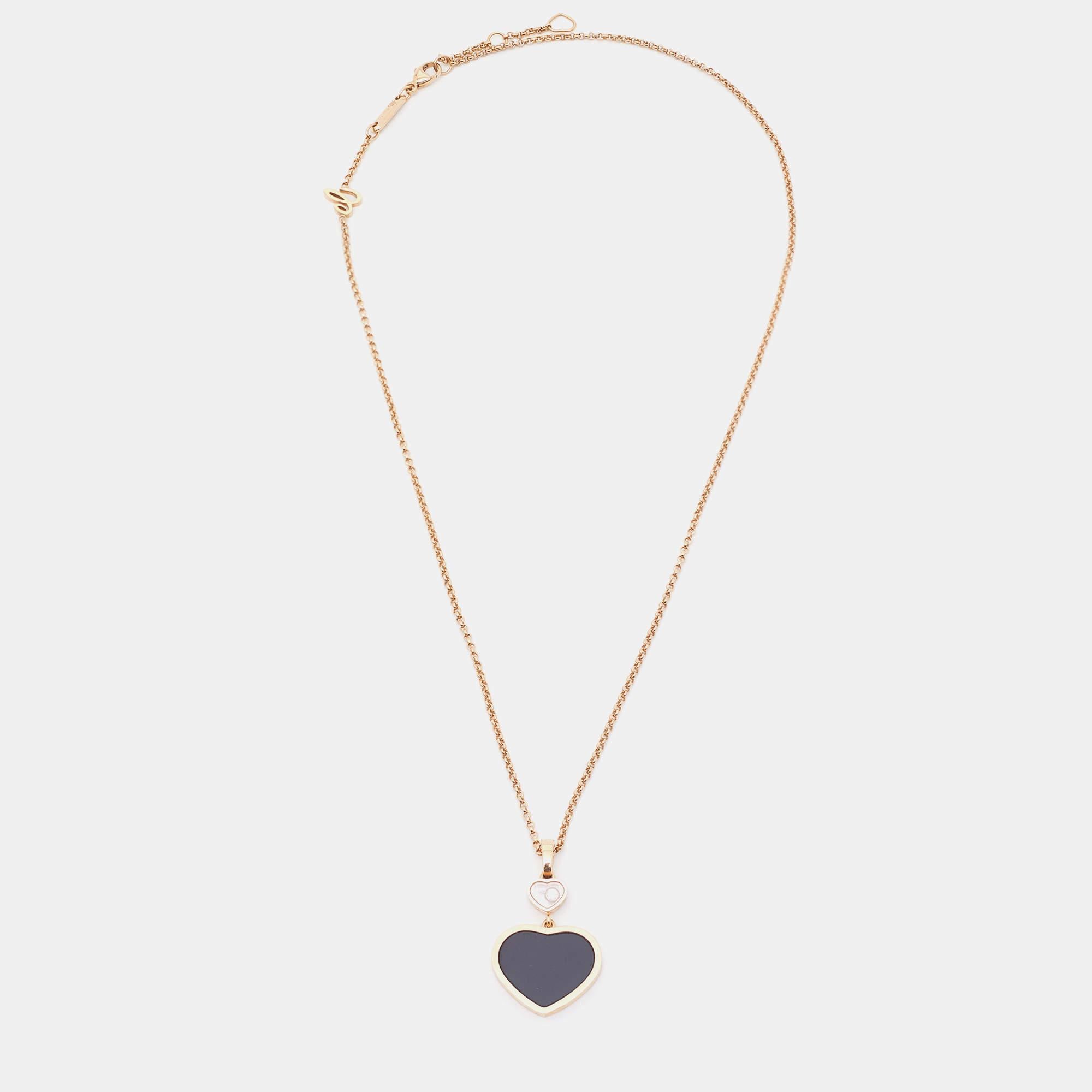 One look at this wondrous necklace from Chopard and our hearts flutter. It is from their Happy Hearts collection and has been created from 18k rose gold to shine. The chain holds two hearts - the larger one is inlaid with onyx and the smaller one