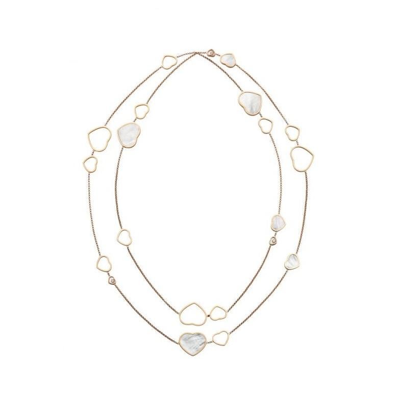 Chopard HAPPY HEARTS SAUTOIR NECKLACE with 18-carat rose gold and natural Mother-of-Pearl.  This timeless sautoir necklace in 18-carat rose gold shines with elegant hearts contrasting solid and void: natural mother-of-pearl, rose gold openwork and a