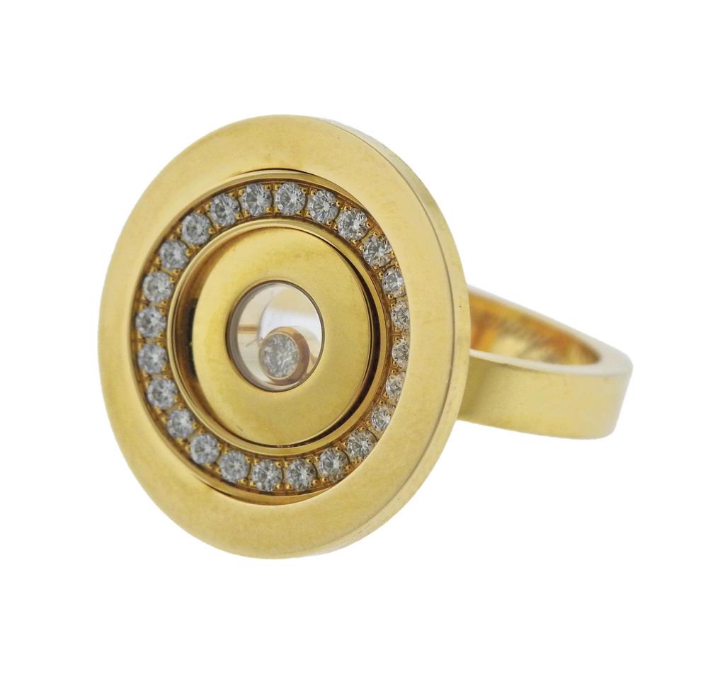  18k yellow gold Happy Spirit ring by Chopard, set with iconic floating diamond in the center and rounds around the top, approx. 0.34ctw VVS/FG. Comes with COA and Box. Ring size - 7.5mm, ring top - 20mm in diameter, weighs 12.7 grams. Marked:
